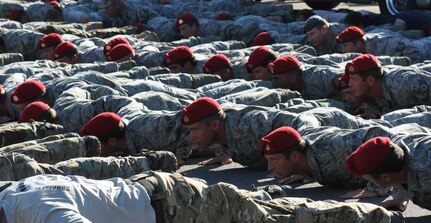 U.S. Air Force special tactics Airmen conduct memorial pushups at the completion of the Tim Davis Special Tactics Memorial March from Lackland Air Force Base, Texas, to Hurlburt Field, Fla., Oct. 21, 2010. Fifteen special tactics Airmen completed the 860-mile trek to honor the memories of their fallen comrades. (U.S. Air Force Photo by Airman 1st Class Joe W. McFadden/Released)