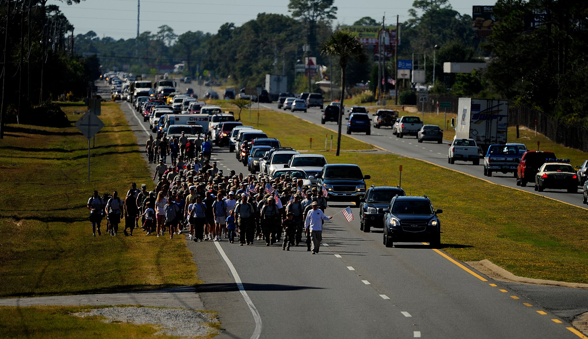 Surviving family members, a few wounded Airmen and members of the Air Force Special Operations Command, join fifteen Special Tactics Airmen on the final stretch of an 860-mile memorial march from San Antonio, Tex. to Hurlburt Field, Fla., Sept. 21, 2010. (U.S. Air Force Photo by Master Sgt. Russell E. Cooley IV/Released)