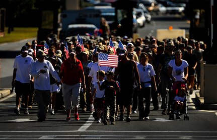 Surviving family members, a few wounded Airmen and members of the Air Force Special Operations Command, join fifteen Special Tactics Airmen on the final stretch of an 860-mile memorial march from San Antonio, Tex. to Hurlburt Field, Fla., Sept. 21, 2010. (U.S. Air Force Photo by Master Sgt. Russell E. Cooley IV/Released)