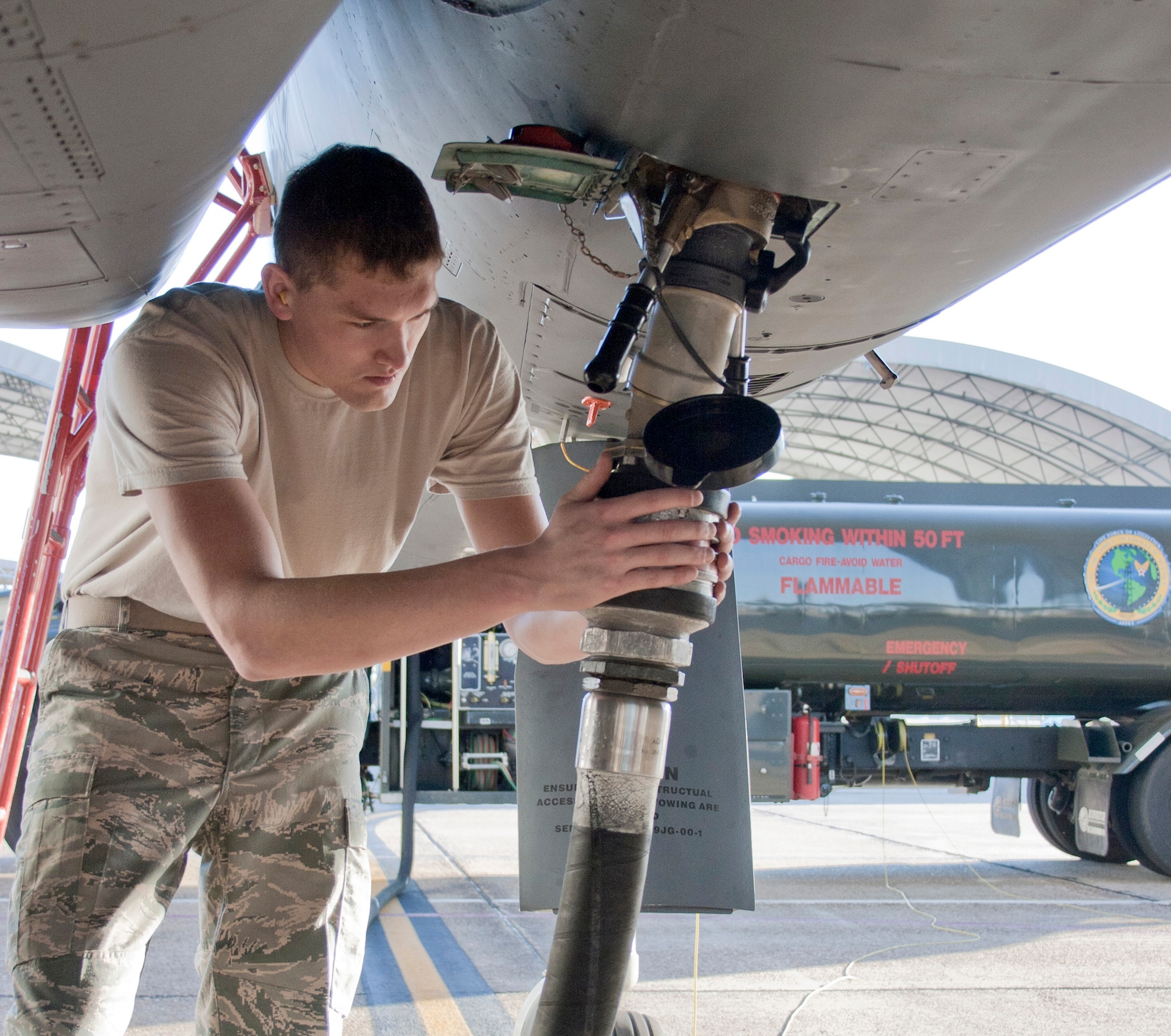 Senior Airman Jacob Prine checks the fuel connection to a F-15 Eagle Oct. 22, 2010, prior to a flight test of new, environmentally-friendly fuel. Aircrews from the 46th Test Wing and Air Force engineers evaluated flight parameters using a blend of standard JP-8 fuel and hydro-treated, renewable jet biofuel. The Air Force is working toward changing half of the continental U.S. jet fuel requirement to alternative fuels by 2016. (U.S. Air Force photo/2nd Lt. Andrew Caulk)