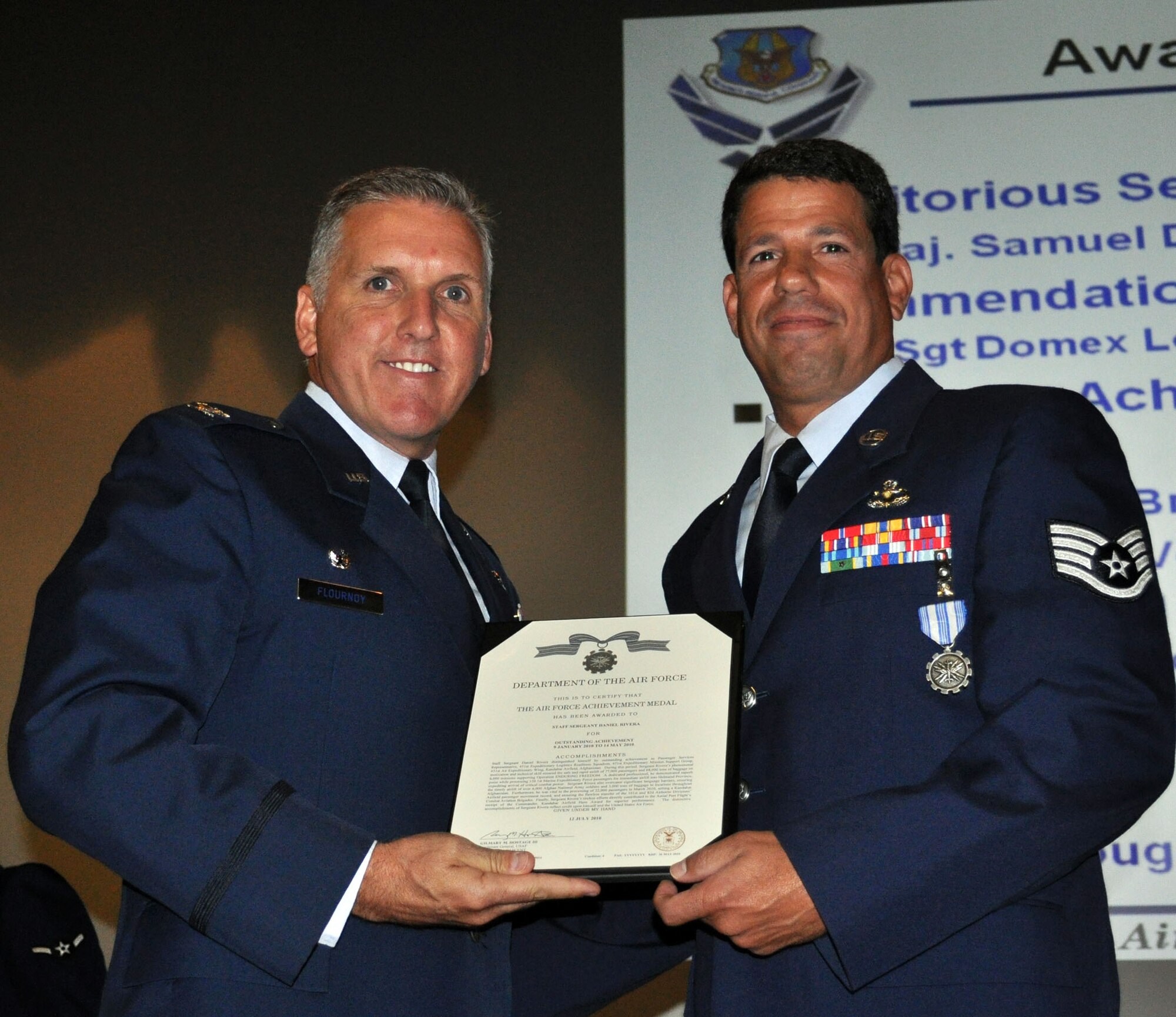 TRAVIS AIR FORCE BASE, Calif. -- Col. Jay Flournoy, wing commander, pins the Air Force Achievement medal on Staff Sgt. Daniel Rivera, 45th Aerial Port Squadron, during a recent 349th Wing Commanders Call (U.S. Air Force photo/Senior Master Sgt. Jeffrey Rachal) 