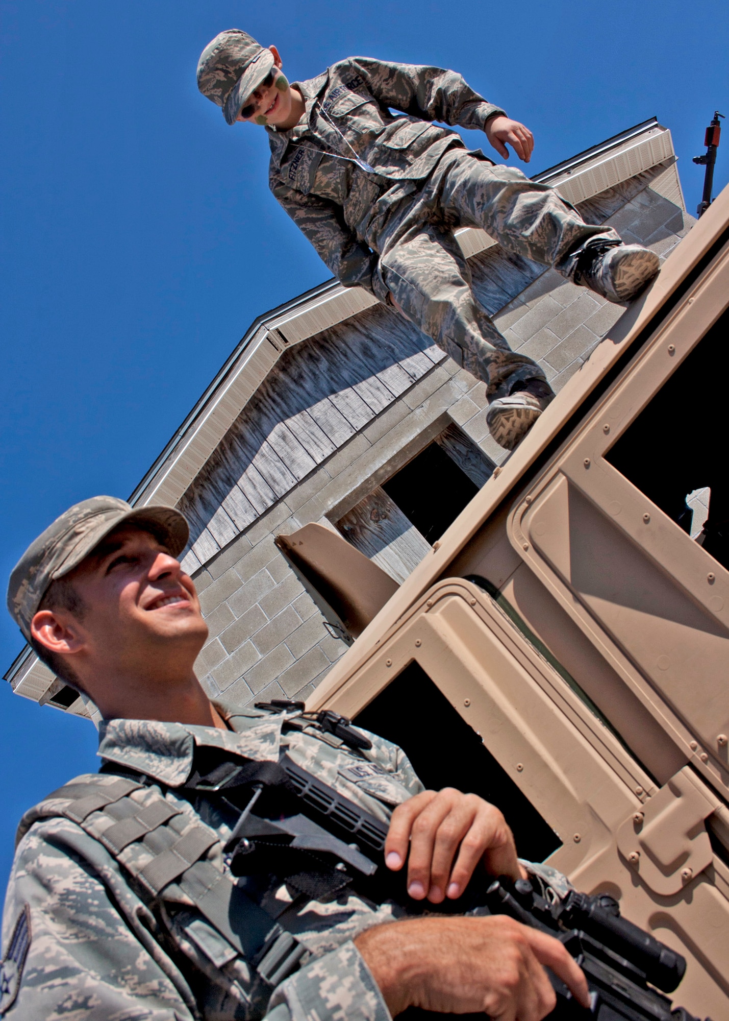 EGLIN AIR FORCE BASE, Fla. - Riley Fitzner, son of Alaina Fitzner, checks out the view from the top of a Humvee during Operation Hero Oct. 22 at the Ground Combat Training Squadron. Eglin organizations showed children some of the training and procedures their parents would go through for a deployment. (U.S. Air Force photo/2nd Lt. Andrew Caulk.)