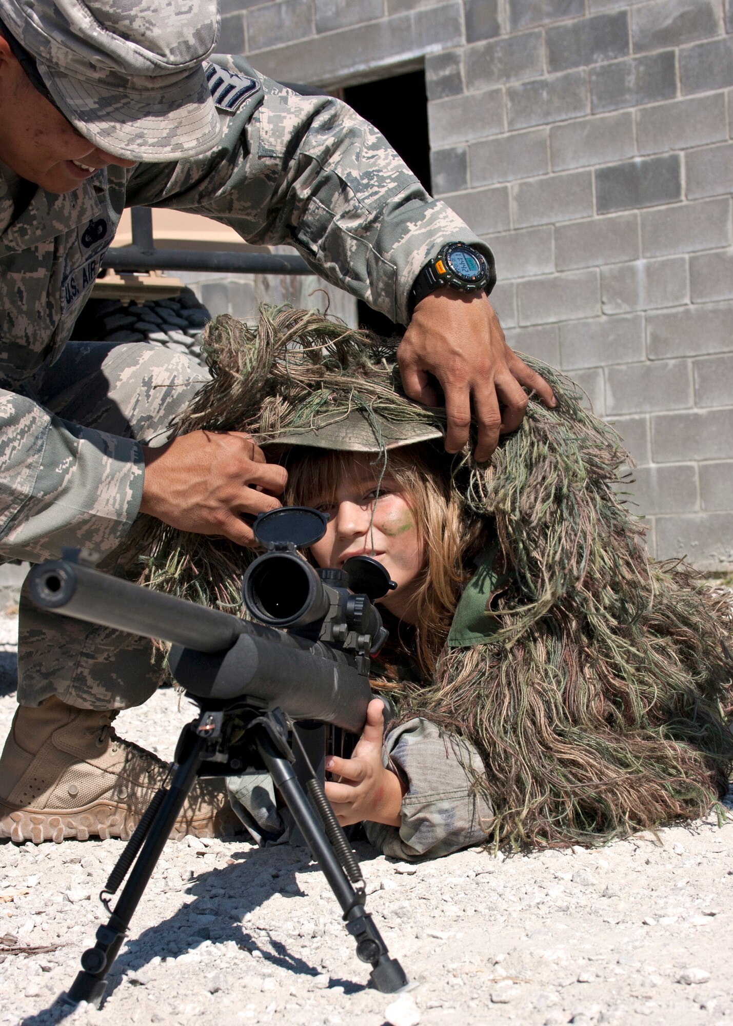 EGLIN AIR FORCE BASE, Fla. - Kayley Merker dons the “sniper suit” during the Operation Hero event Oct. 22 at Eglin Air Force Base, Fla. Eglin organiztions showed children training and procedures their parents would encounter during a deployment.  (U.S. Air Force photo/2nd Lt. Andrew Caulk.)
