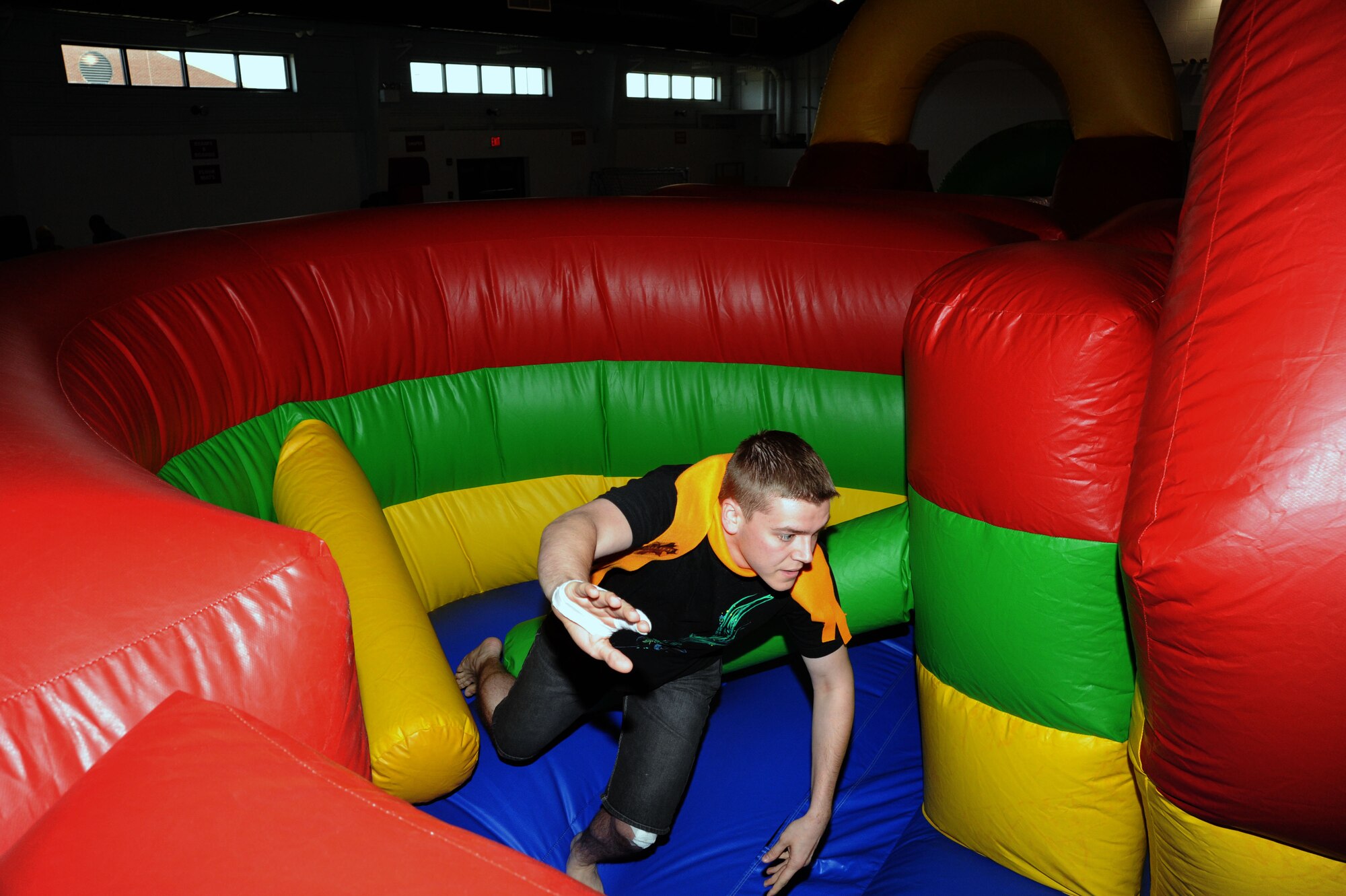 Senior Airman Wesley Orr, 319th Communications Squadron, races through an inflatable obstacle course Oct. 21 during Fall Fest on Grand Forks Air Force Base, N.D. Fall Fest included various events to boost the morale of servicemembers and their families. The 319th Operations Support Squadron won the grand prize drawing of $300. (U.S. Air Force photo by Tech. Sgt. Johnny Saldivar)