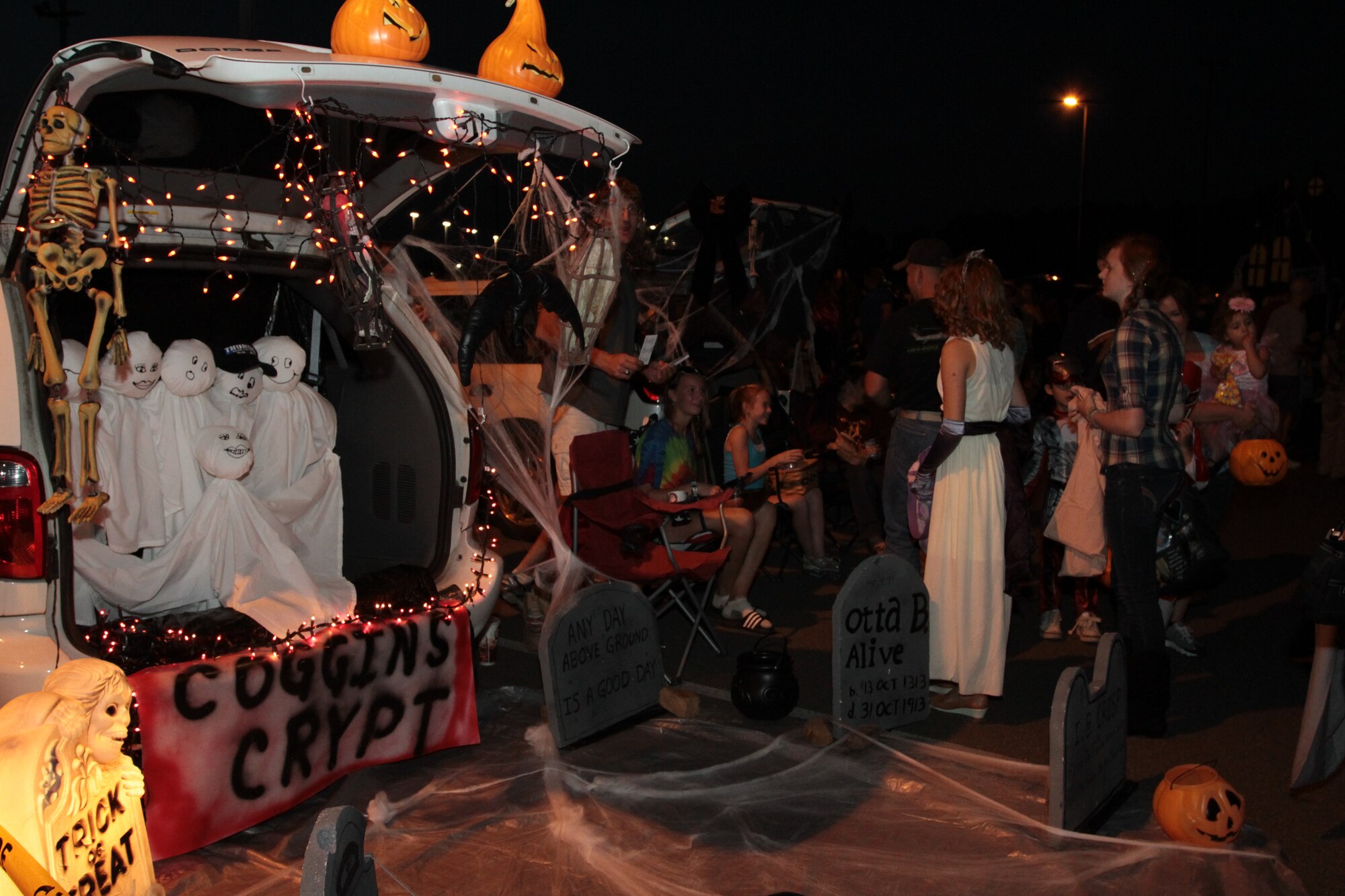 Base families trick-or-treat Oct. 23 during the base’s Trunk-or-Treat event. The event, sponsored by the Little Rock Spouses’ Club, included a number of vehicle trunks decorated for Halloween with candy stations and was a safe alternative to trick-or-treating house to house. (U.S. Army photo by Spc. Jared Sollars)