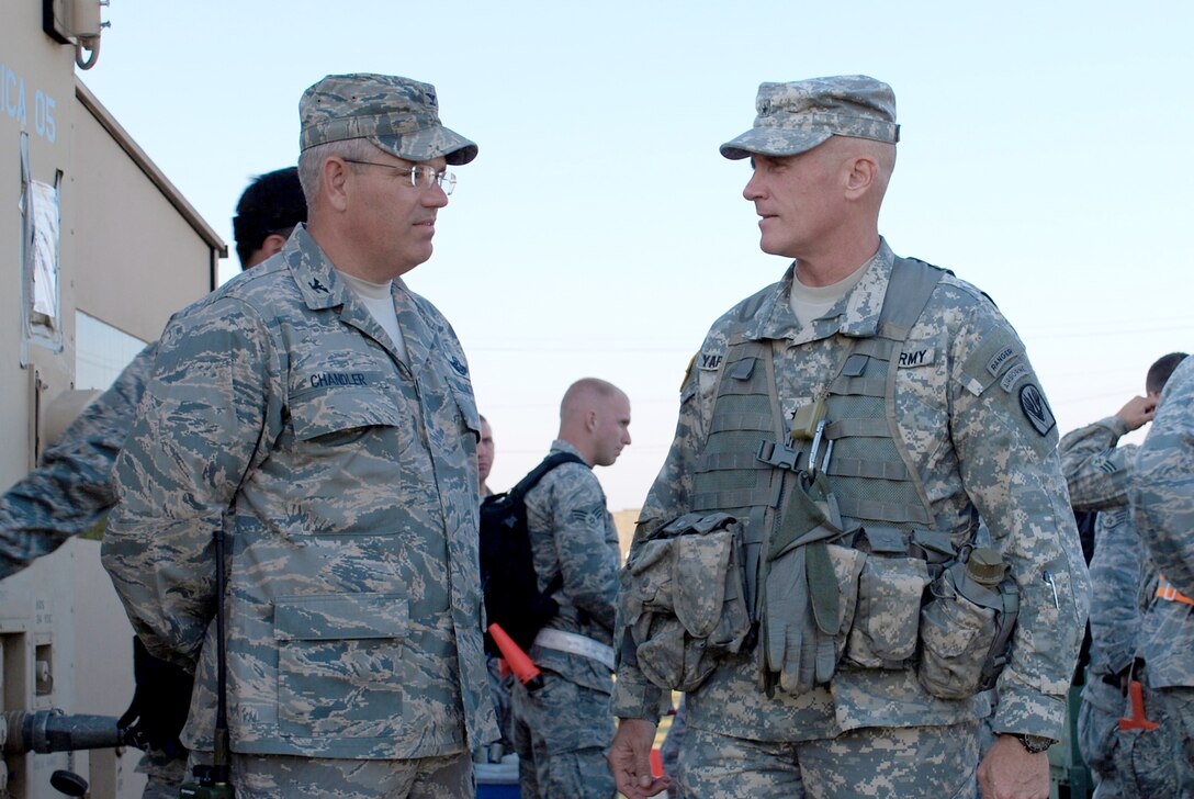 Col. David Chandler discusses operations with Brig. Gen. James Yarbrough during a Joint Readiness Training Center exercise Oct. 18 at Alexandria International Airport in Lousiana. Colonel Chandler is the 570th Contingency Response Group commander and General Yarbrough is the Joint Readiness Training Center commander. (U.S. Air Force photo/Capt. Paradon Silpasornprasit)