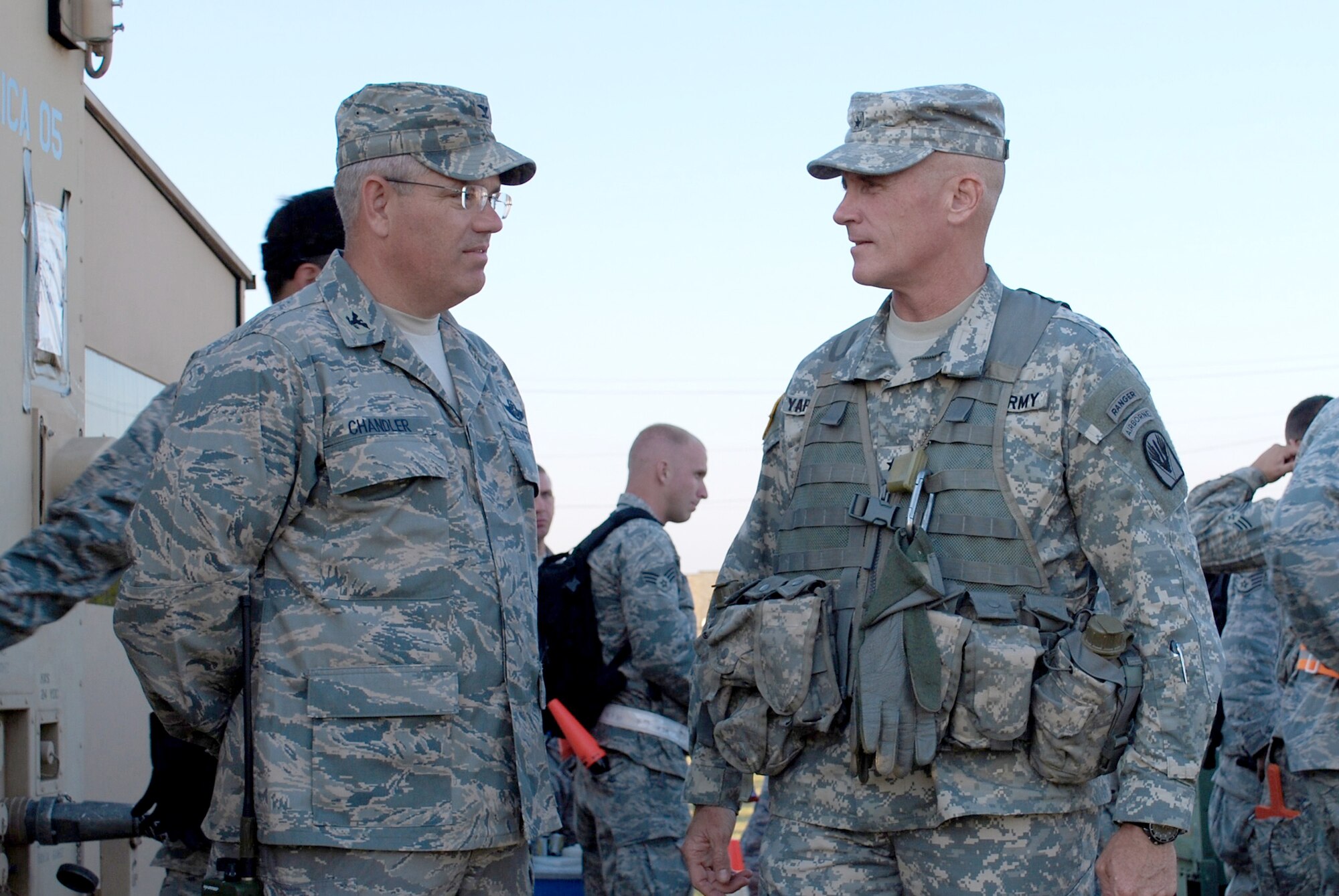 Col. David Chandler discusses operations with Brig. Gen. James Yarbrough during a Joint Readiness Training Center exercise Oct. 18 at Alexandria International Airport in Lousiana. Colonel Chandler is the 570th Contingency Response Group commander and General Yarbrough is the Joint Readiness Training Center commander. (U.S. Air Force photo/Capt. Paradon Silpasornprasit)