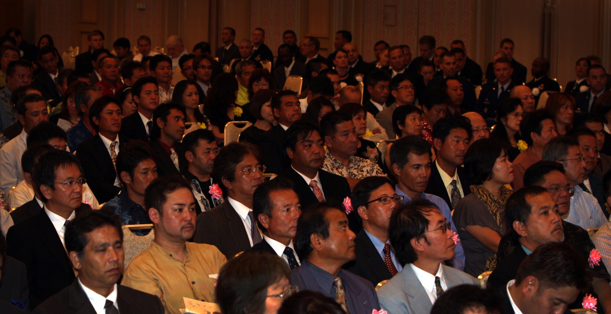 An audience of Okinawans  watch as base employees are recognized for their years of service at the Laguna Garden Hotel in Ginowan as they celebrate 8,000 total years of support to American forces on Okinawa, Oct. 21. The Government of Japan hosts a Length of Service Award for Master Labor Contract (MLC) and Indirect Hire Agreement (IHA) employees in recognition of their years of dedicated service each year. (U.S. Air Force Photo/Charles "Chip" Steitz) 