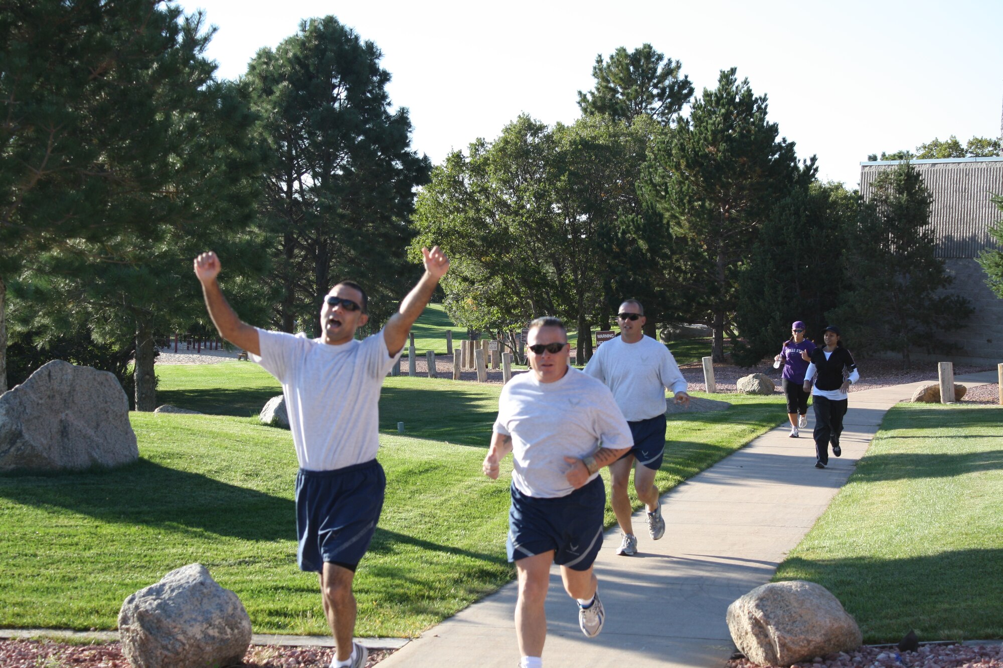 CHEYENNE MOUNTAIN AIR FORCE STATION, Colo. – Staff Sgt. Cedric Smith, Tech. Sgt Thomas Ryan and Master Sgt. William Seguin take off in the 2.5 mile running portion in the inaugural Combined Federal Campaign Mini-Triathlon Oct. 7 at Cheyenne Mountain Air Force Station. The event, which included lunch, was an opportunity to spread awareness about the federal workplace giving campaign. The 21st Space Wing’s goal this year is to reach a 25 percent participation rate. The wing is focused on participation in hopes of sparking a culture of giving. Last year, 21st SW Airmen gave $248,000 to support local, state and national charities. This year, there is an online site to make giving quick and easy. Go to, www.cfcnexus.org/_peakcfc. (U.S. Air Force photo/Nathan Ryder)