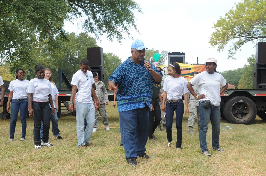 BARKSDALE AIR FORCE BASE, La. -- Larry Hill, military retiree, demonstrates a dance move to Captain Shreve High School Army Junior ROTC during the 14th annual Celebrate Barksdale hosted by the Military Affairs Council Oct. 22. The main event, a base-wide picnic, took place on the lawn of Chapel 1 where food and drinks were served by Military Affairs Council members. There were many booths set up including a children's play area, a face painting booth and balloon animals were made by a clown for children. (U.S. Air Force photo/Airman First Class Joseph Boals) (RELEASED)
