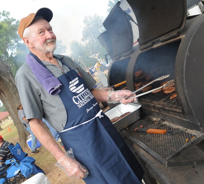 BARKSDALE AIR FORCE BASE, La. -- James Ramsey, Citizens National Bank director, prepares burgers for the 14th annual Celebrate Barksdale hosted by the Military Affairs Council Oct. 22. The main event, a base-wide picnic, took place on the lawn of Chapel 1 where food and drinks were served. A total of 5,000 hamburger patties and 3,000 hotdogs were cooked and served at the picnic. (U.S. Air Force photo/Senior Airman Alexandra Boutte) (RELEASED)