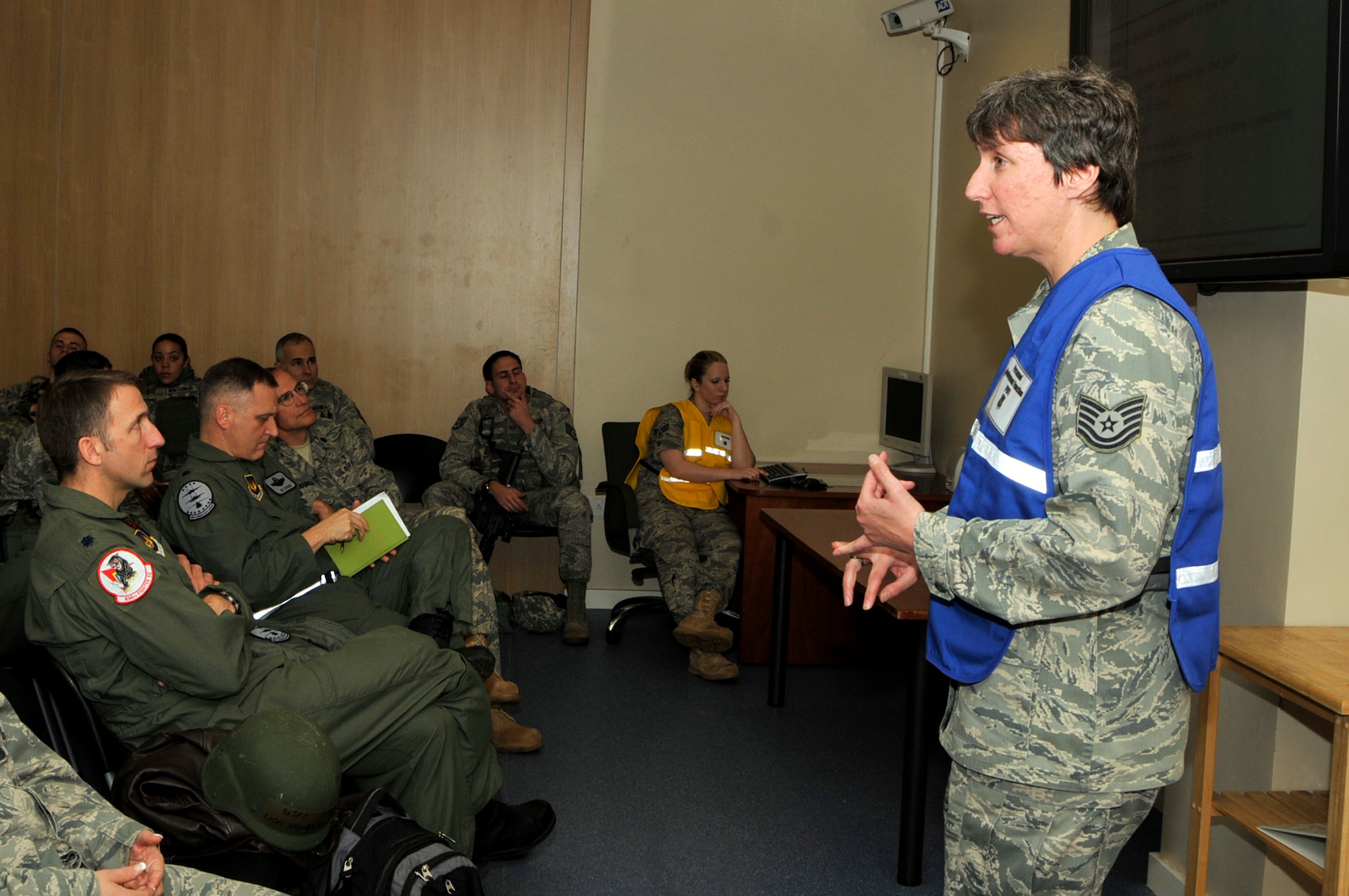 ROYAL AIR FORCE LAKENHEATH, England -Tech Sgt. Jennifer Algiere, 48th Fighter Wing ground safety manager, gives the safety briefing to a deploying chalk of Liberty Warriors at the deployment readiness center during an operational readiness inspection Oct. 25. These Airmen are deploying Saxon Air Base, Anglia. (U.S. Air Force photo/Airman 1st Tiffany Deuel)