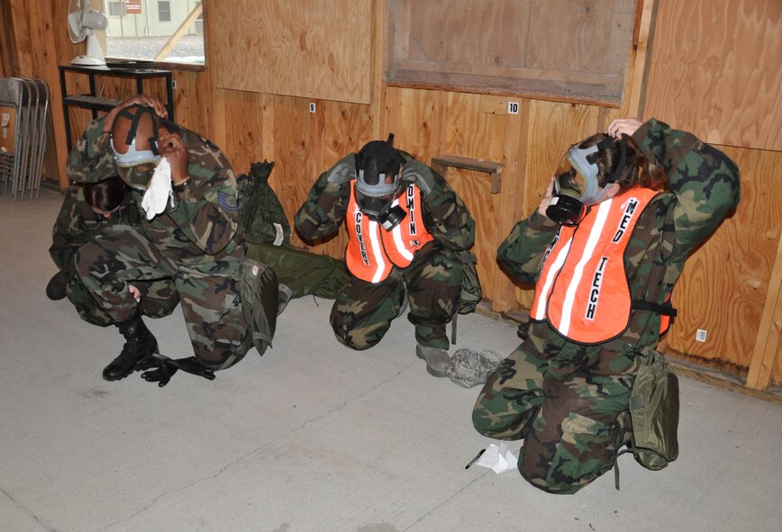 WRIGHT-PATTERSON AIR FORCE BASE, Ohio – Reservists from the 445th Aeromedical Staging Squadron don their gas masks during a training exercise Oct. 2.  More than 100 Airmen completed ATSO (the ability to survive and operate) training during the October unit training assembly that included mission oriented protective postures, alarm conditions, and force protection actions.  The group also participated in flu outbreak, security issues and medical recovery exercises. (U.S. Air Force photo/Senior Airman Matthew Cook)