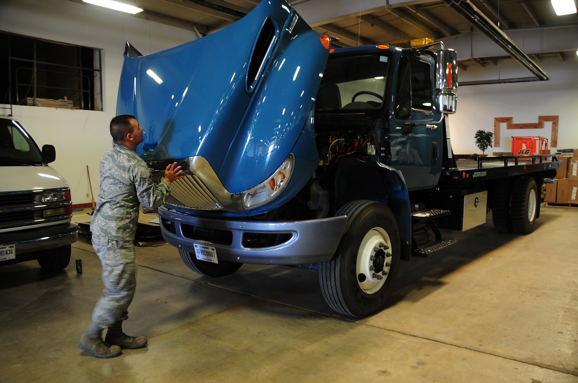 ELLSWORTH AIR FORCE BASE, S.D. -- Airman 1st Class Gregory Hulett, 28th Logistics Readiness Squadron, vehicle operator, does pre-operational checks on a flatbed truck, Oct. 6.  While the handling and delivery of cargo is a primary function of the vehicle operations control center shop, it’s not the only role they are required to fill in support of missions both stateside and downrange. (U.S. Air Force photo/Airman 1st Class Anthony Sanchelli)