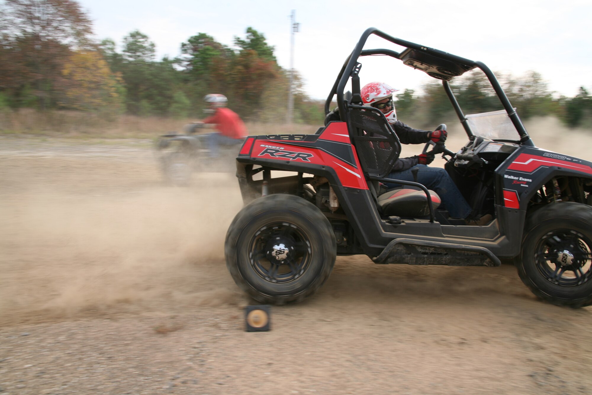 Base Airmen navigate the all-terrain vehicle course Saturday. Base safety officials offer the ATV course to help Airmen and their families stay safe in the popular off-duty, high-risk activity. For information about the next free course, call the base safety office at 987-3290. (U.S. Air Force photo by Bob Oldham)