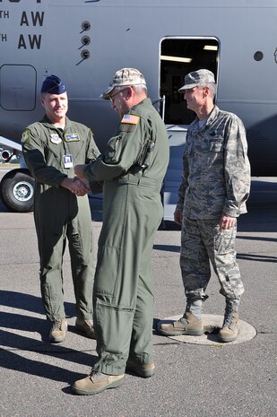 Major General Martin Mazick (center), vice commander for the Air Force Reserve Command, talks with Col. John Wood (left), commander of the 437th Airlift Wing and Colonel Steven Chapman, commander of the 315th Airlift Wing after delivering Joint Base Charleston’s newest C-17.  (U.S. Air Force photo/Staff Sgt. Shane Ellis)