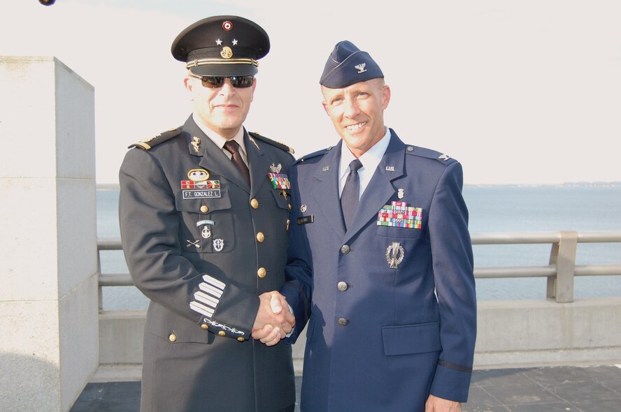 Col. Bruce Peters, 47th Medical Group commander, greets Maj. Gen. Francisco Gonzalez, commander, at the 50th anniversary of the Abrazo ceremony. The Abrazo, in Spanish means to embrace or hug in greeting a person, is an annual tradition that symbolizes the friendship of the Republic of Mexico and the United States of America. (U.S. Air Force photo by George McKnight)