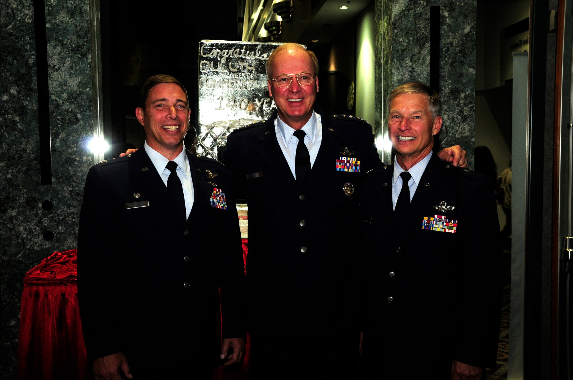 General Craig McKinley, chief of the National Guard Bureau, poses for a photo with former 148th Fighter Wing Commander and current Assistant Adjutant General - Air, Bridagadier Gen. Timothy Cossalter, and current 148th FW Commander, Colonel Frank Stokes at the annual Chamber of Commerce Dinner and Gala held on Oct. 21, 2010 at the Duluth Entertainment and Convention Center in Duluth, Minn.  Gen. McKinley was the keynote speaker for the event and spoke highly of 148th accomplishments and the communities' positive support of military members.    (U.S. Air Force photo by MSgt Ralph Kapustka)