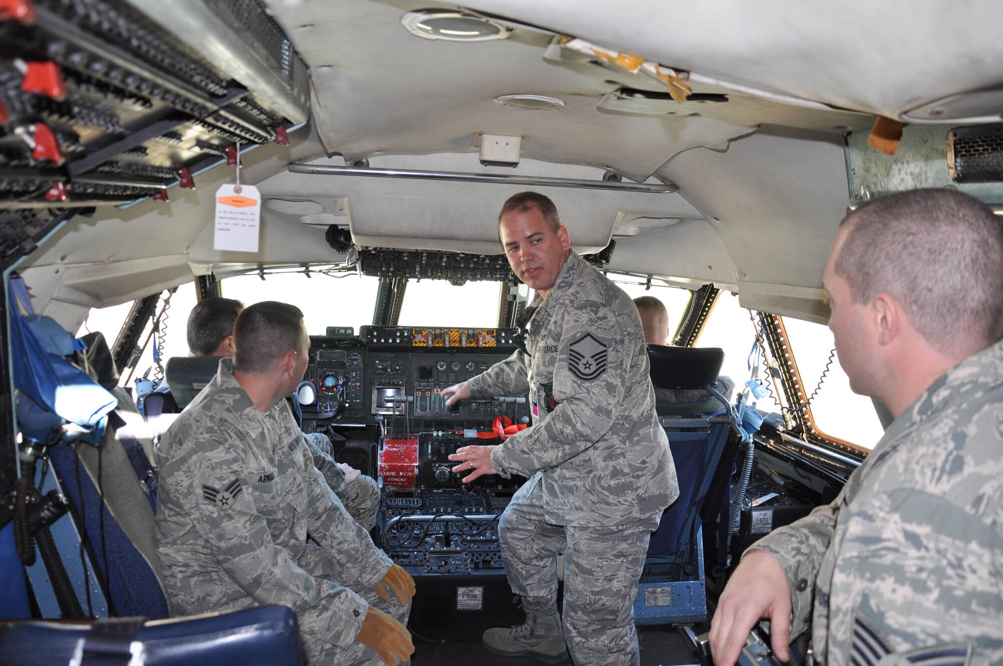 WRIGHT-PATTERSON AIR FORCE BASE, Ohio – Master Sgt. Barry Nichols, 445th Civil Engineer Squadron firefighter, explains emergency shutdown procedures for a C-5 Galaxy to fellow 445th firefighters as part of a training exercise performed during the Oct. 17 unit training assembly. (U.S. Air Force photo/Senior Airman Mikhail Berlin)
