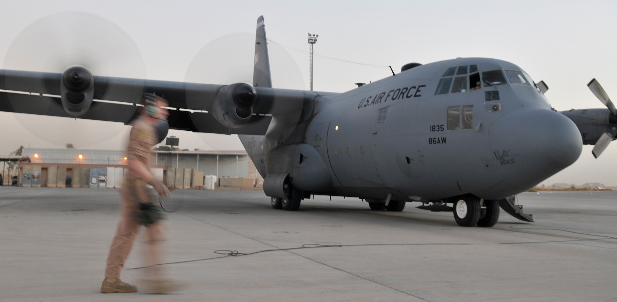 Airman 1st Class Alex Morris, 777th Expeditionary Airlift Squadron flight engineer, checks the engines during a pre-flight start up Oct. 19, 2010, Joint Base Balad, Iraq. C-130s start the engines on the right wing first due to the aircrafts-wiring configuration. Airman Morris is deployed from Little Rock Air Force Base, Ark. (U.S. Air Force photo/Tech. Sgt. Phillip Butterfield)