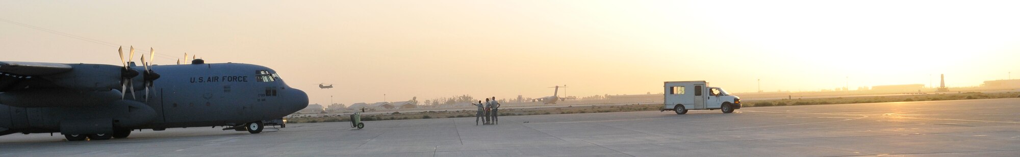 Airmen of the 777th Expeditionary Aircraft Maintenance Unit prepare a C-130 Hercules for a night mission Oct. 19, 2010, Joint Base Balad, Iraq. Even with Operation New Dawn, dusk and night missions are the norm with servicemembers of JBB. C-130s primarily perform the tactical portion of the airlift mission. The aircraft is capable of operating from rough dirt strips and is the prime transport for air dropping troops and equipment into hostile areas. (U.S. Air Force photo/Tech. Sgt. Phillip Butterfield)