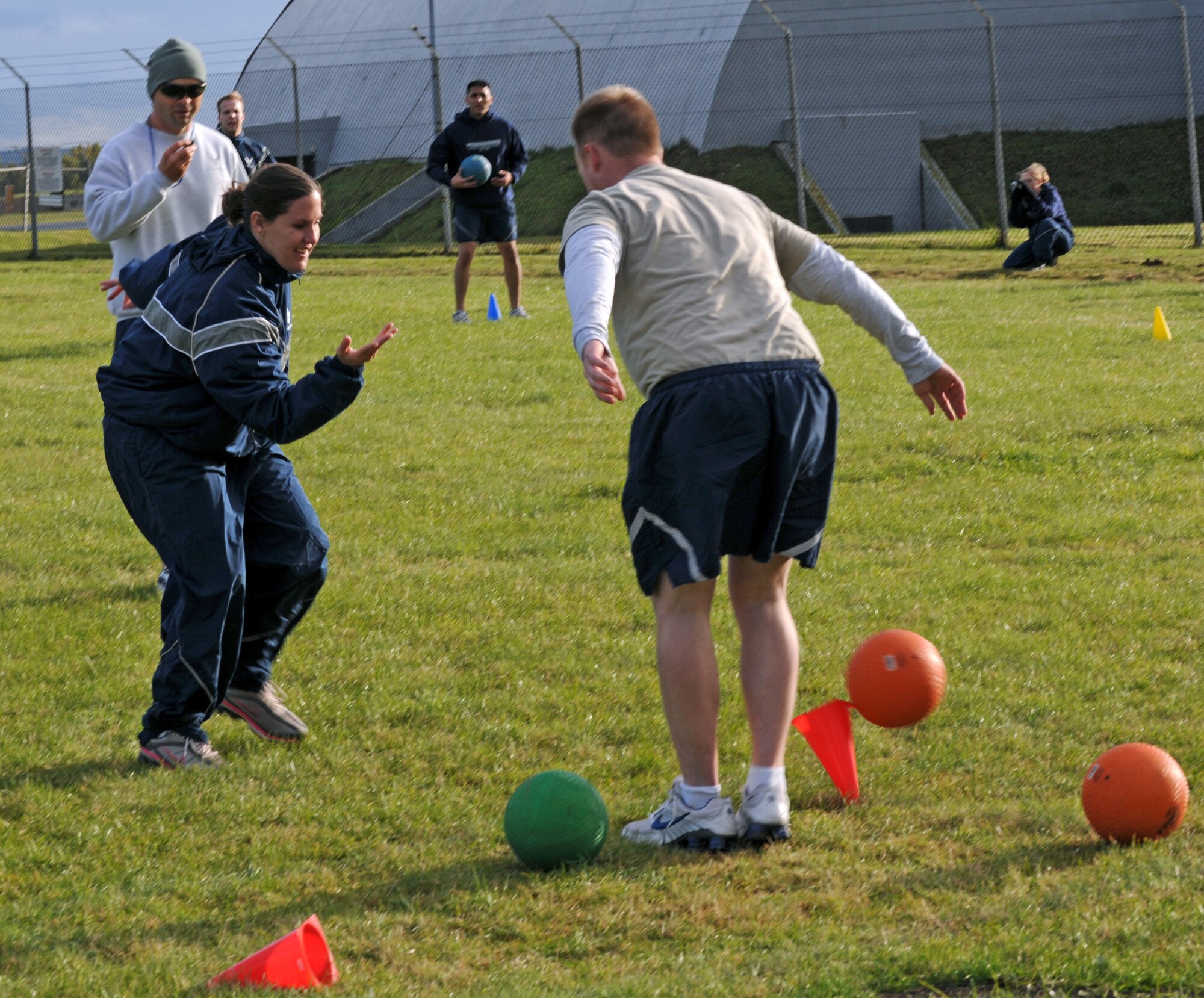 SPANGDAHLEM AIR BASE, Germany – Staff Sgt. Amanda Koldeway, 52nd Operations Support Squadron, knocks down one of her opposing team’s cones during a game of Icarus as opponent Senior Airman Andrew Fox, 52nd Operations Support Squadron Airman Leadership School student, attempts to stop her. The game was introduced to the ALS class as an opportunity to teach the young enlisted members about air and space principles along with the fundamentals of leadership, followership and teamwork. (U.S. Air Force photo/Airman 1st Class Matthew B. Fredericks)
