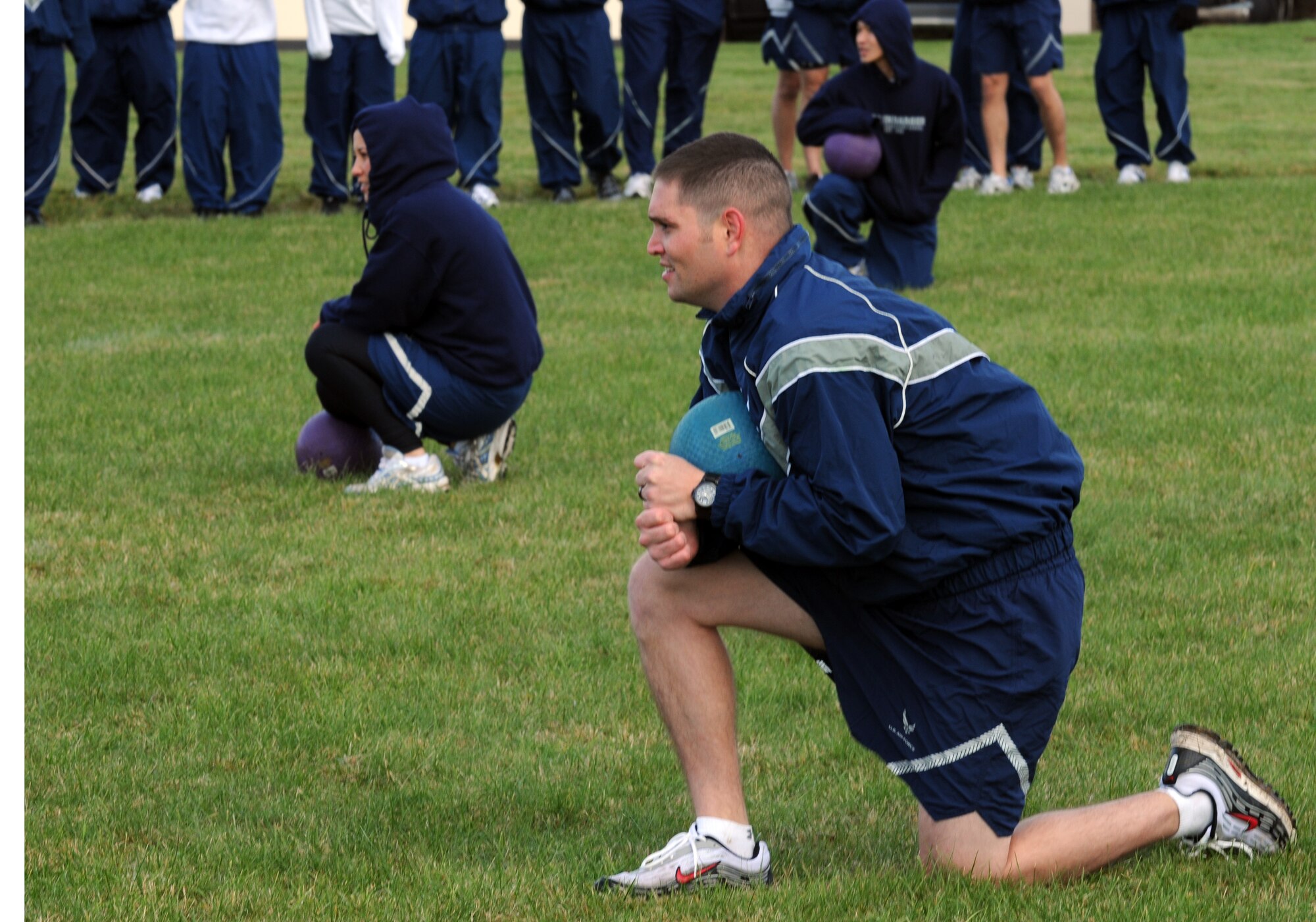 SPANGDAHLEM AIR BASE, Germany – Staff Sgt. Brandon Ludemann, 52nd Operations Support Squadron, takes a knee while playing a game of Icarus against Airman Leadership School students Oct. 20. The game was introduced to the Airman Leadership School class as an opportunity to teach the young enlisted members about air and space principles along with the fundamentals of leadership, followership and teamwork. (U.S. Air Force photo/Airman 1st Class Matthew B. Fredericks)