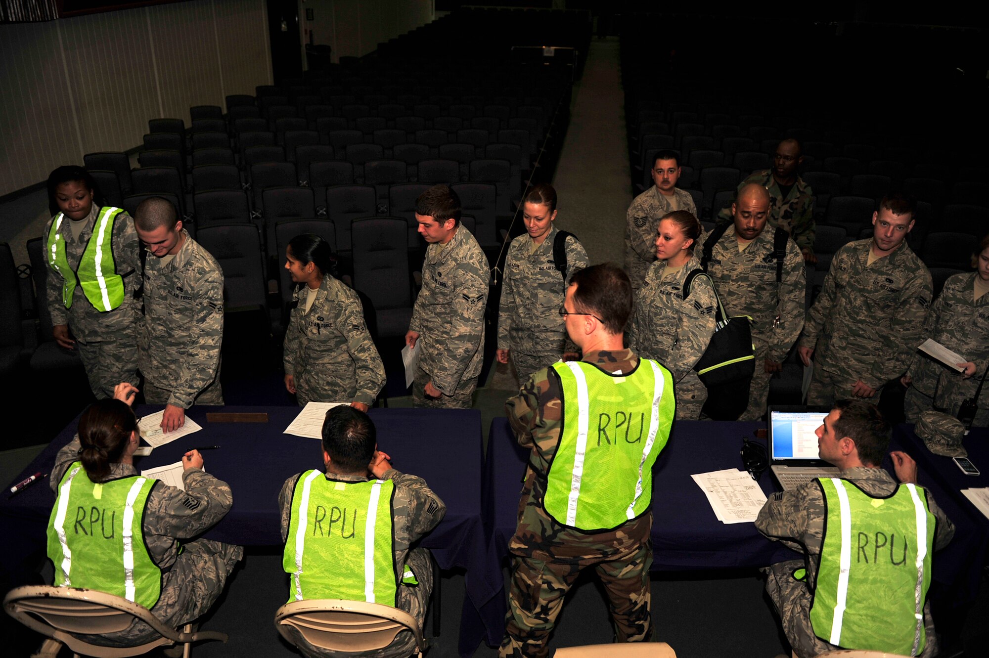Members of the 18th Wing process through the receiving line during the Beverly high 11-01 exercise here at Kadena Air Base. October, 25 2010.All Kadena personnel to include the tenant units are participating. (U.S. Air Force photo/Staff Sgt. Lakisha A. Croley)