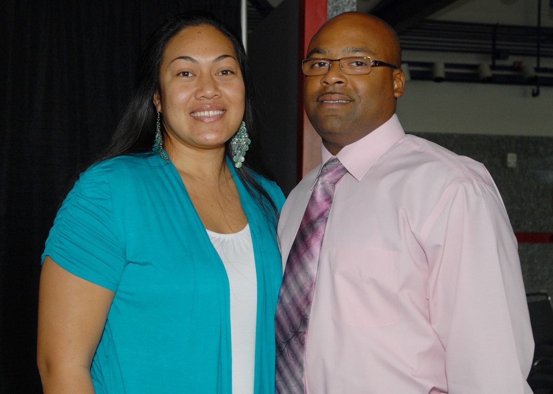 Derrick Thomas and his wife, Army Cpl. Mele Thomas, pose for a picture during a Yellow Ribbon Reintegration Program, a post-deployment event, in Houston, Oct. 17, 2010. Thomas said his wife’s deployment offered some challenges during and after her return. Mele Thomas is a member of the Texas Army National Guard’s 72nd Infantry Brigade Combat Team. DOD photo by Elaine Wilson