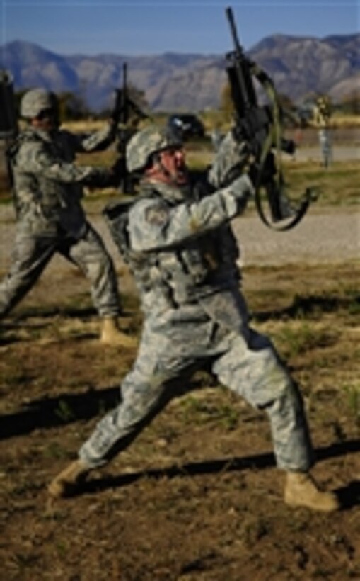 U.S. Air Force Master Sgt. Doug Clayton, with the 75th Security Forces Squadron, practices rifle-fighting techniques during a combat readiness training course at Hill Air Force Base, Utah, on Oct. 18, 2010.  The course provided airmen with deployment skills including tactical movements, land navigation and first-aid buddy care.  