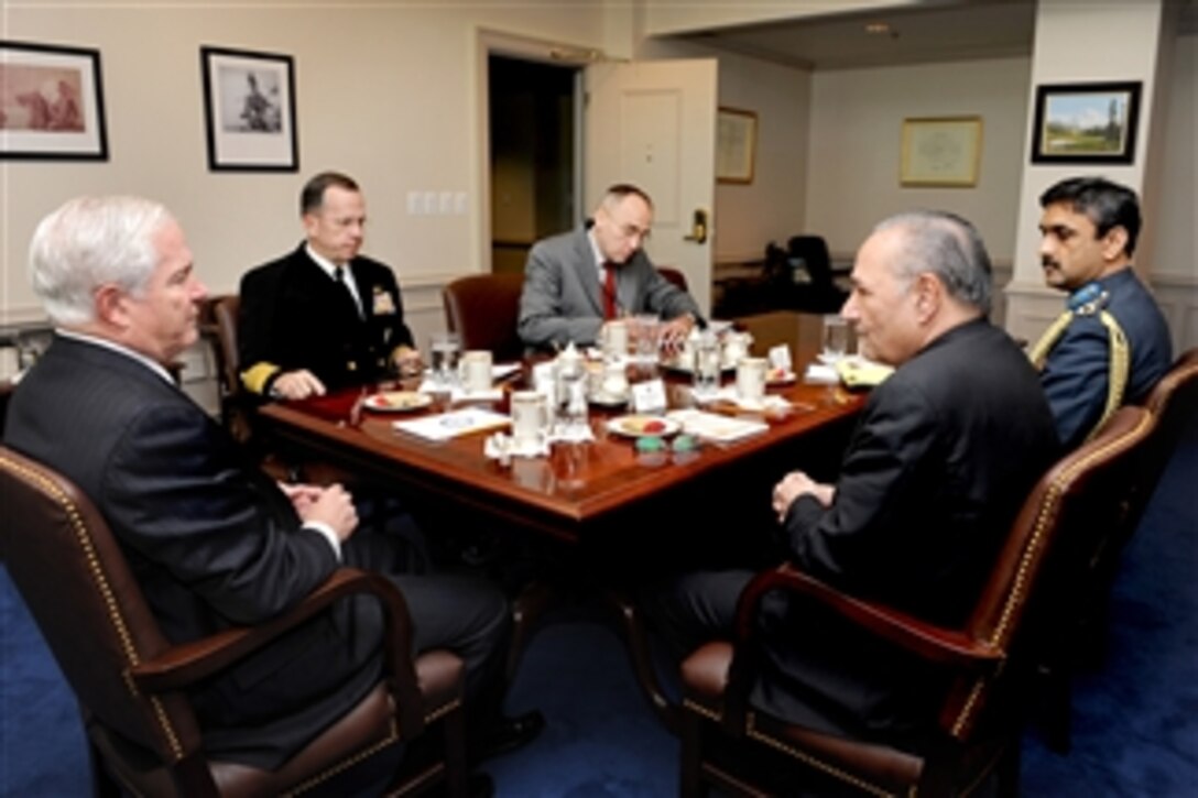 Secretary of Defense Robert M. Gates (left) holds a Pentagon meeting with Pakistani Defense Minister Chaudhry Ahmed Mukhtar (2nd from right).  Gates is joined by Chairman of the Joint Chiefs of Staff Adm. Mike Mullen (2nd from left), U.S. Navy, and Assistant Secretary of Defense for Asia-Pacific Security Affairs Chip Gregson.  Mukhtar is accompanied by Group Capt. Ahmer Shehzad, the air attach‚ at the Pakistan Embassy in Washington, D.C.  