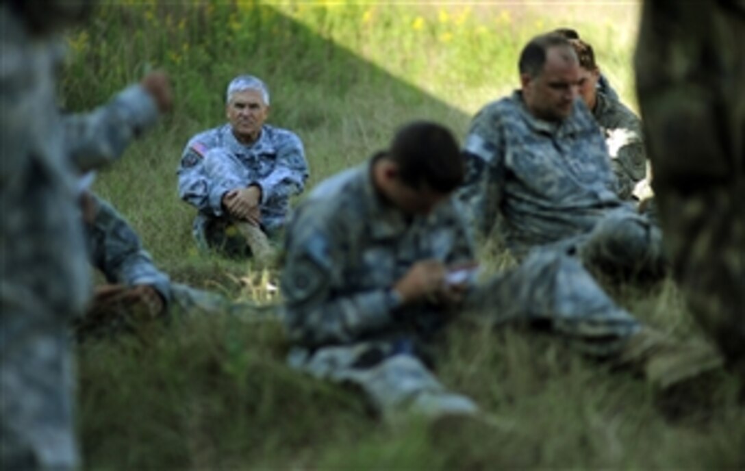 Chief of Staff of the Army Gen. George W. Casey Jr. joins Company Commanders and 1st Sergeants during a "tactical freeze" portion of a Full Spectrum Operation exercise at Ft. Polk, La., on Oct. 23, 2010.  The Full Spectrum exercise focuses on facing and defeating a hybrid threat representing both an insurgent force and an organized military force.  