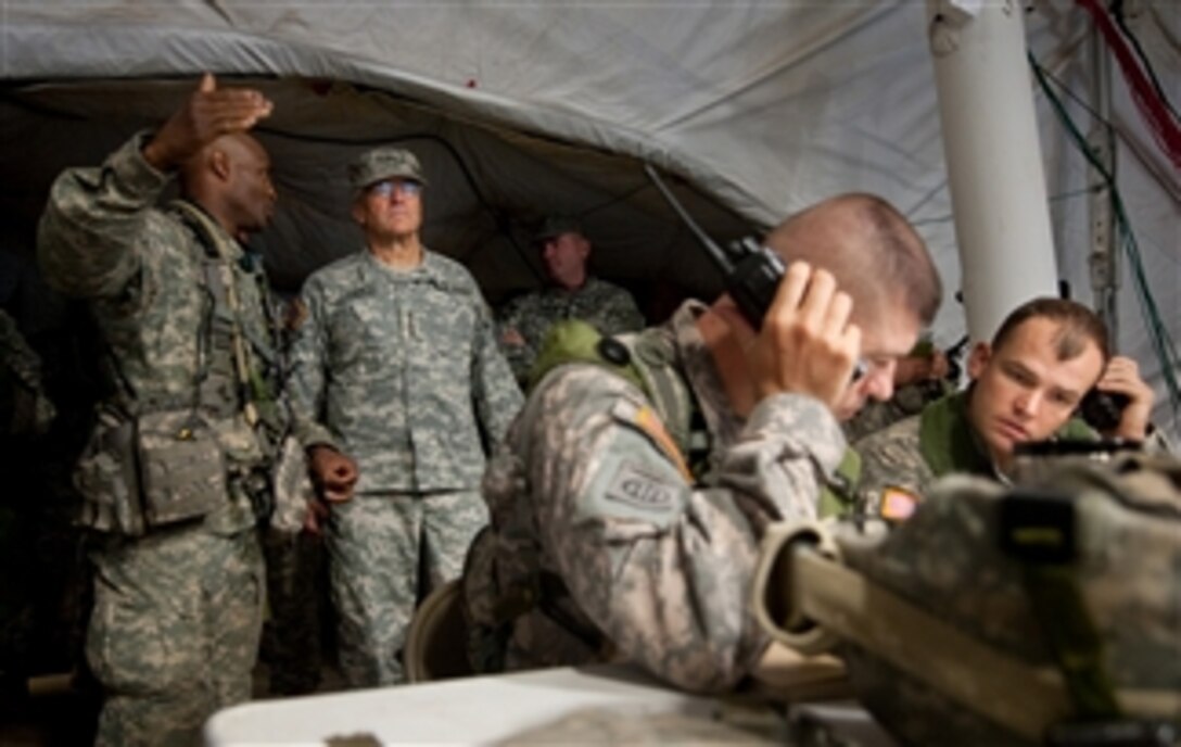 Col. Carl Alex (left), commander of the 3rd Brigade Combat Team, 82nd Airborne Division, briefs Chief of Staff of the Army Gen. George W. Casey Jr. on operations being conducted as part of the Full Spectrum Operation exercise at Ft. Polk, La., on Oct. 23, 2010.  The Full Spectrum exercise focuses on facing and defeating a hybrid threat representing both an insurgent force and an organized military force.  