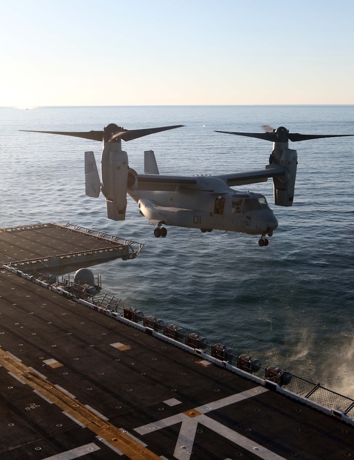 USS IWO JIMA (LHD 7) – A MV-22 Osprey from  Marine Medium Tiltrotor Squadron VMM-261 (Reinforced), 24th Marine Expeditionary Unit,  land on the amphibious assault ship USS Iwo Jima Oct. 25, 2011, during the 24th MEU’s first at sea period with Amphibious Squadron 8 (PHIBRON 8).  The landings are part of the qualification process for the pilots during the PHIBRON/MEU Integration Exercise, known as PMINT.  PMINT will take place Oct. 24 to Nov. 3 and is focused on building the Navy-Marine Team and establishing the working relationships necessary to conduct operations from the sea.  The MV-22 Ospreys are home based at Marine Corps Air Station New River, N.C.  (Official USMC Photo by: GySgt Chad R. Kiehl/ Released)