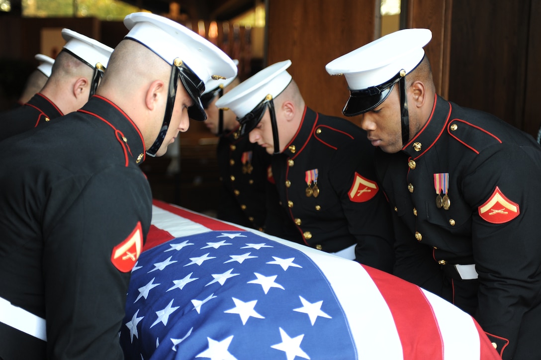 Marine Corps Body Bearers carry the body of Maj. Gen. Warren R. Johnson Sr. inside the Memorial Chapel at Fort Meyer Oct. 26. Johnson, who was a retired artillery officer, was buried in Arlington National Cemetery. (Photo by Cpl. Bobby J. Yarbrough)