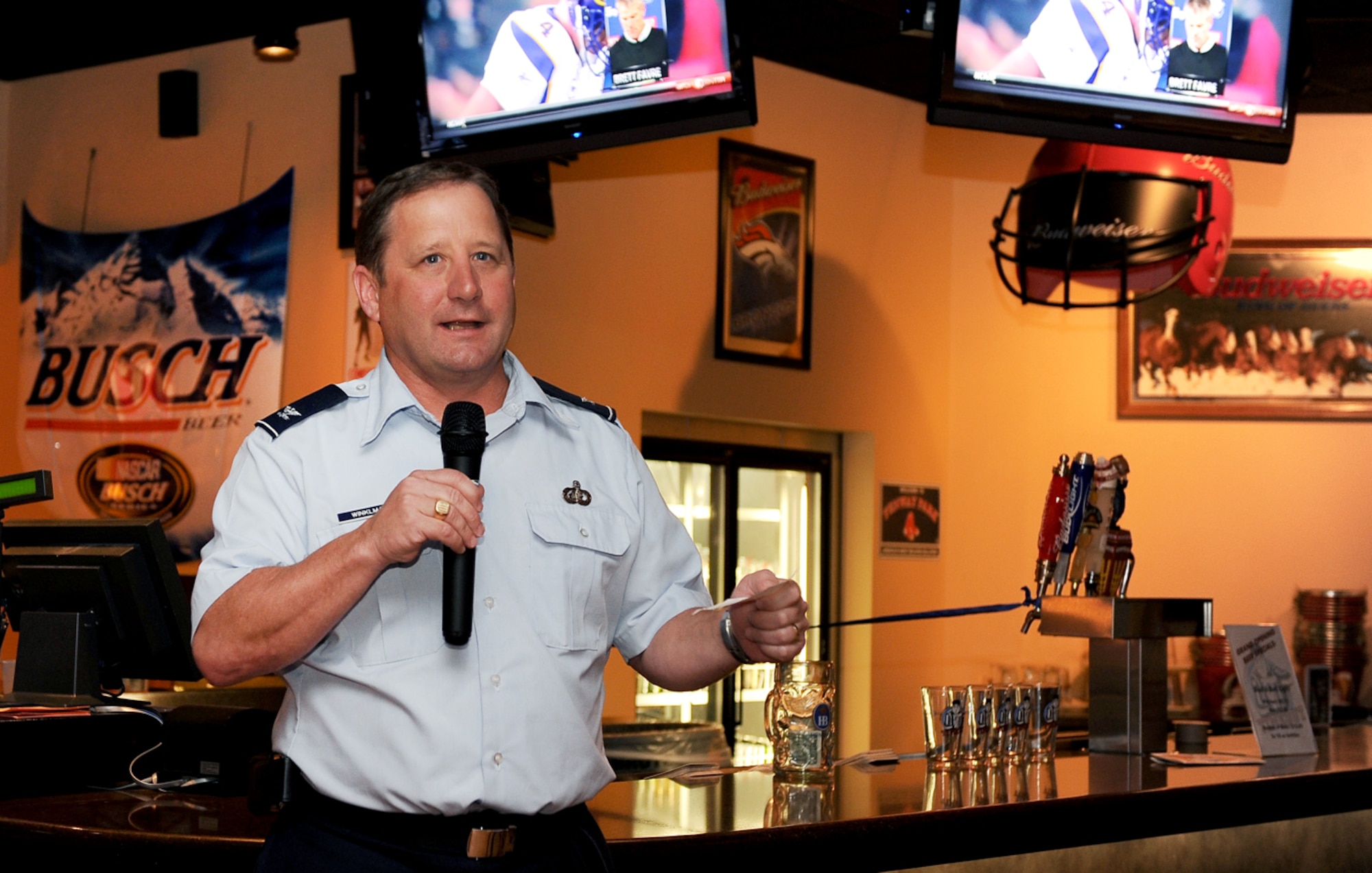 NELLIS AIR FORCE BASE, Nev.--  Col. Steven Winklmann, 99th Air Base Wing vice commander, speaks during the grand opening of the Timeout Sports Lounge Oct. 25 in the Desert Oasis Club. The sports lounge was designed for Airmen of all ranks and provides various options for entertainment. (U.S Air Force Photo / Senior Airman Stephanie Rubi)