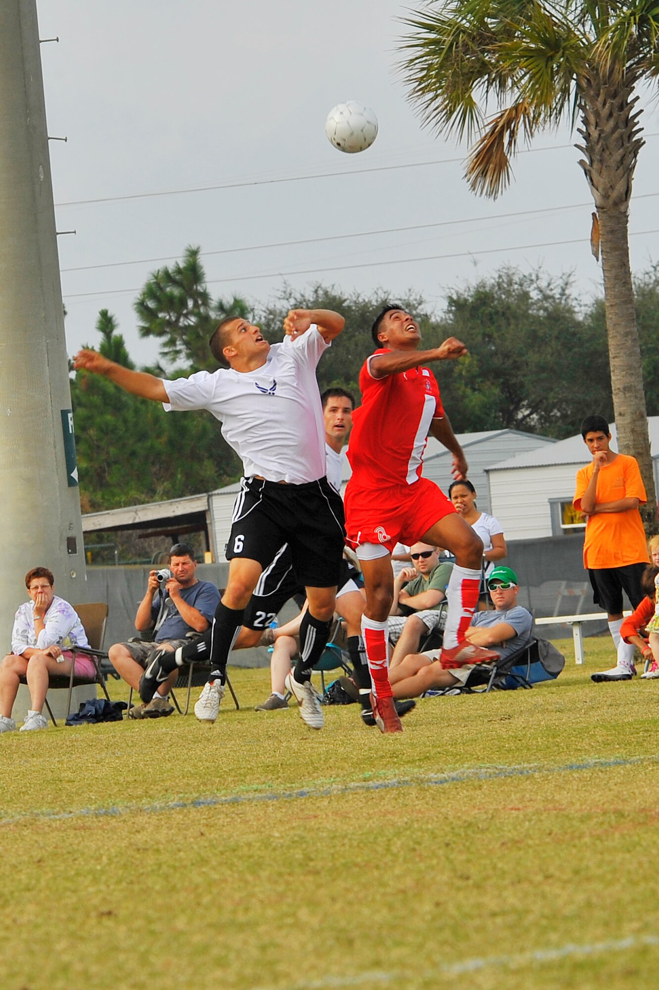 U.S. Air Force Airman 1st Class Steve Bordelon and U.S. Marine Corps Lance Cpl. Kyende Bormentar jump to head the ball during the Armed Forces Men's Soccer Championship consolation match at Morgan Sports Complex, Destin, Fla., Oct. 24, 2010. The Armed Forces Championships are conducted by the Armed Forces Sports council for the purposes of promoting understand goodwill and competition among the Armed Services.  Airman Bordelon is assigned to Naval Air Station New Orleans, La. and Corporal Bormentar is assigned to Norfolk, Va. (DoD photo by U.S. Air Force Senior Airman Sheila deVera/RELEASED)
