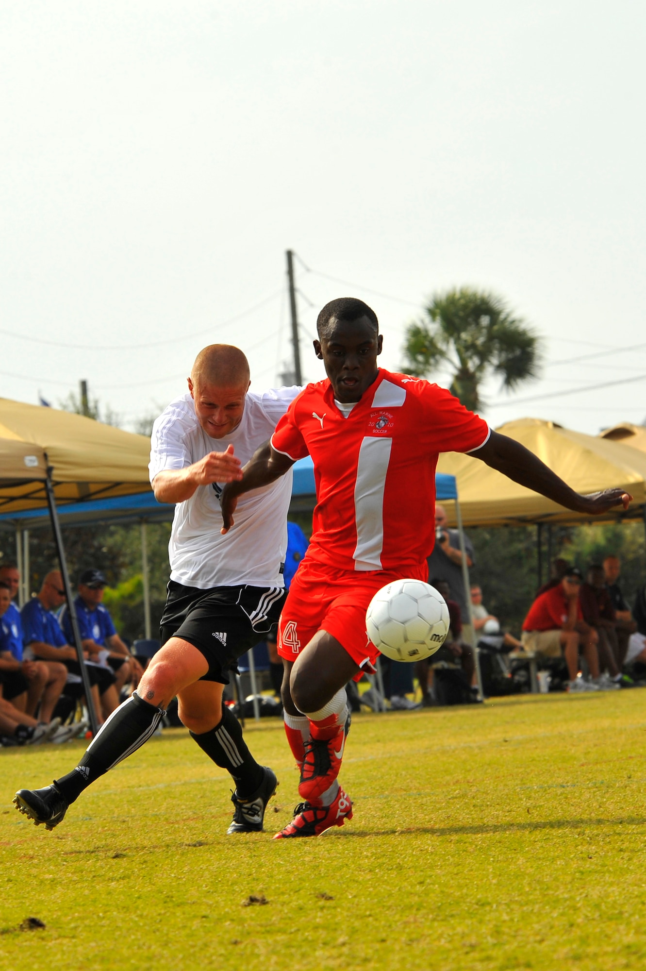 U.S. Air Force Senior Airman Joseph Royer, attempts to steal the ball from U.S. Marine Corps Lance Cpl. Rene Renteria during the Armed Forces Men's Soccer Championship consolation match at Morgan Sports Complex, Destin, Fla., Oct. 24, 2010. The top players from the tournament will be chosen to represent the US in the International Military Sports Competition.  Airman Royer is assigned to Travis Air Force Base, Calif., and Corporal Reneteria is assigned to 29 Palms, Calif. (DoD photo by U.S. Air Force Senior Airman Sheila deVera/RELEASED)

