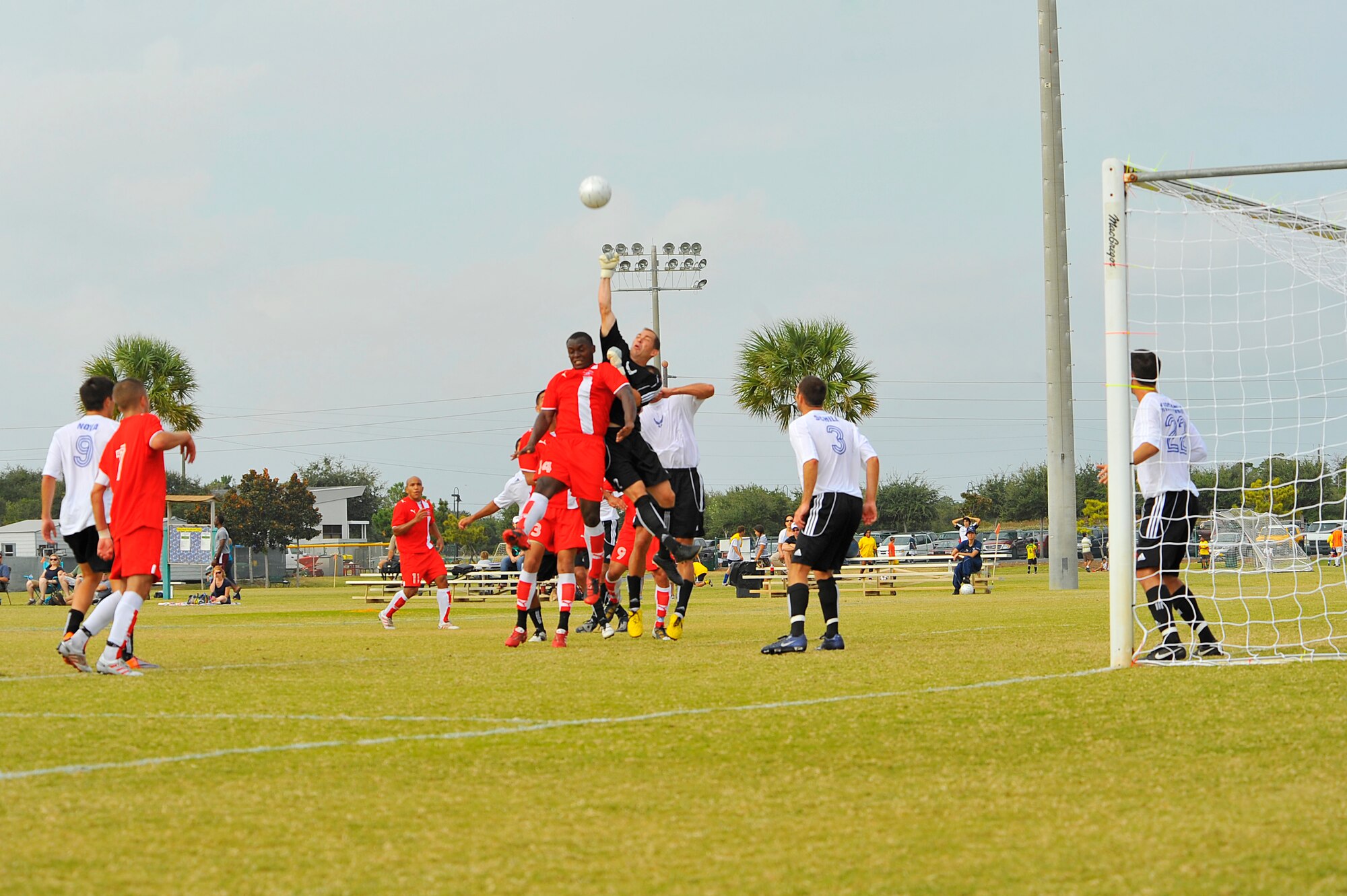 U.S. Air Force Tech Sgt. Patrick Nichols, Air Force soccer team goalie,  punches the ball during the Armed Forces Men's Soccer Championship at Morgan Sports Complex, Destin, Fla., Oct. 24, 2010. The Armed Forces Championships are conducted by the Armed Forces Sports council for the purposes of promoting understand goodwill and competition among the Armed Services. Sergeant Nichols is assigned to U.S. Air Force Academy, Colo. (DoD photo by U.S. Air Force Senior Airman Sheila deVera/RELEASED)
