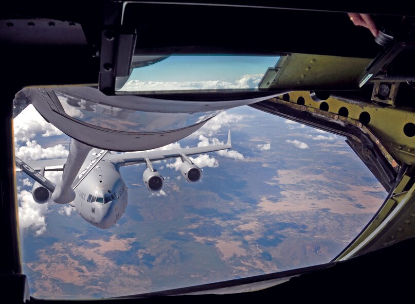 A 729th Airlift Squadron C-17 Globemaster III flies in position for refueling behind a 336th Air Refueling Squadron KC-135R Stratotanker, Oct. 16.  (U.S. Air Force photo by Linda Welz)