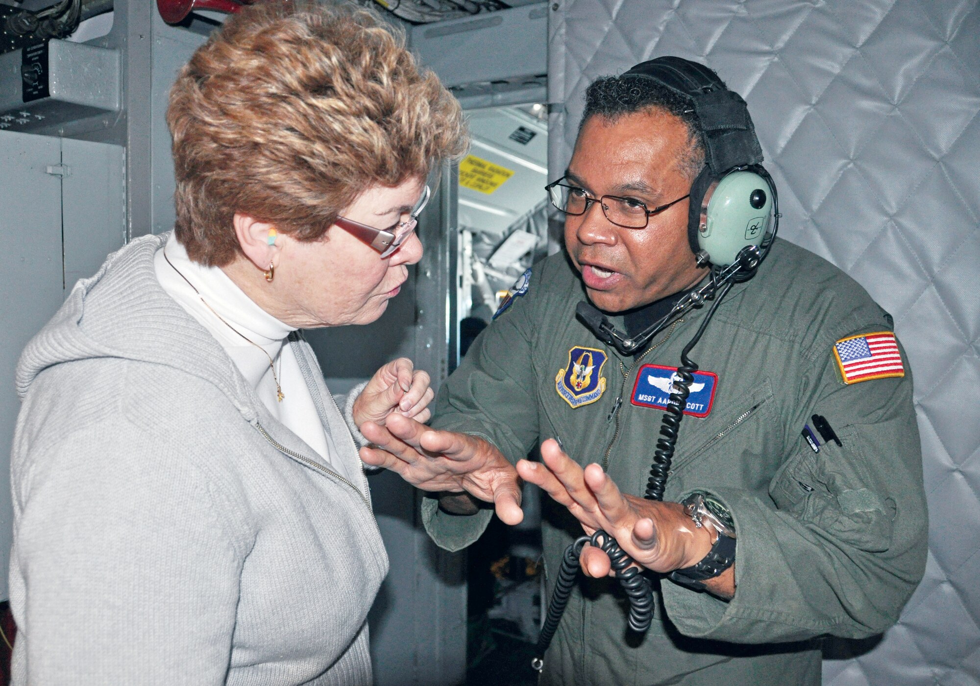 Master Sgt. Aaron Scott, 336th Air Refueling Squadron boom operator, talks to Mary Samson, Naval Hospital Camp Pendleton, Oct. 16. Capt. Santiego Grijalva, 452nd Aeromedical Evacuation Squadron, nominated Ms. Samson.  (U.S. Air Force photo by Linda Welz)