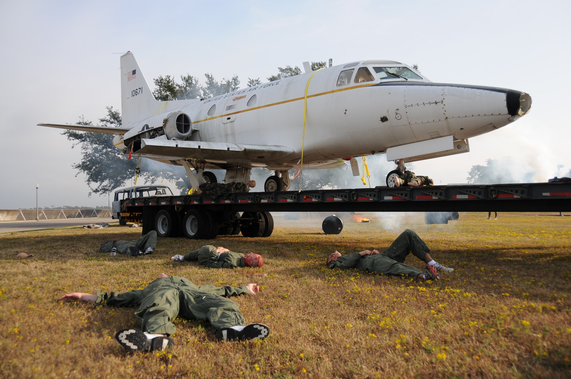 In Tuesday's major accident response exercise a C-130J made a hard landing, lost engine power and crashed into a six-passenger van, coming to rest on the Triangle track north of Alho Manor.  The scenario also included a spill from chemicals on the aircraft, hydraulic fluid and JP-8 fuel.  Three people "died" and 30 were "injured" in the accident, part of this week's Air Education and Training Command Compliance Inspection.  (U.S. Air Force photo by Kemberly Groue)