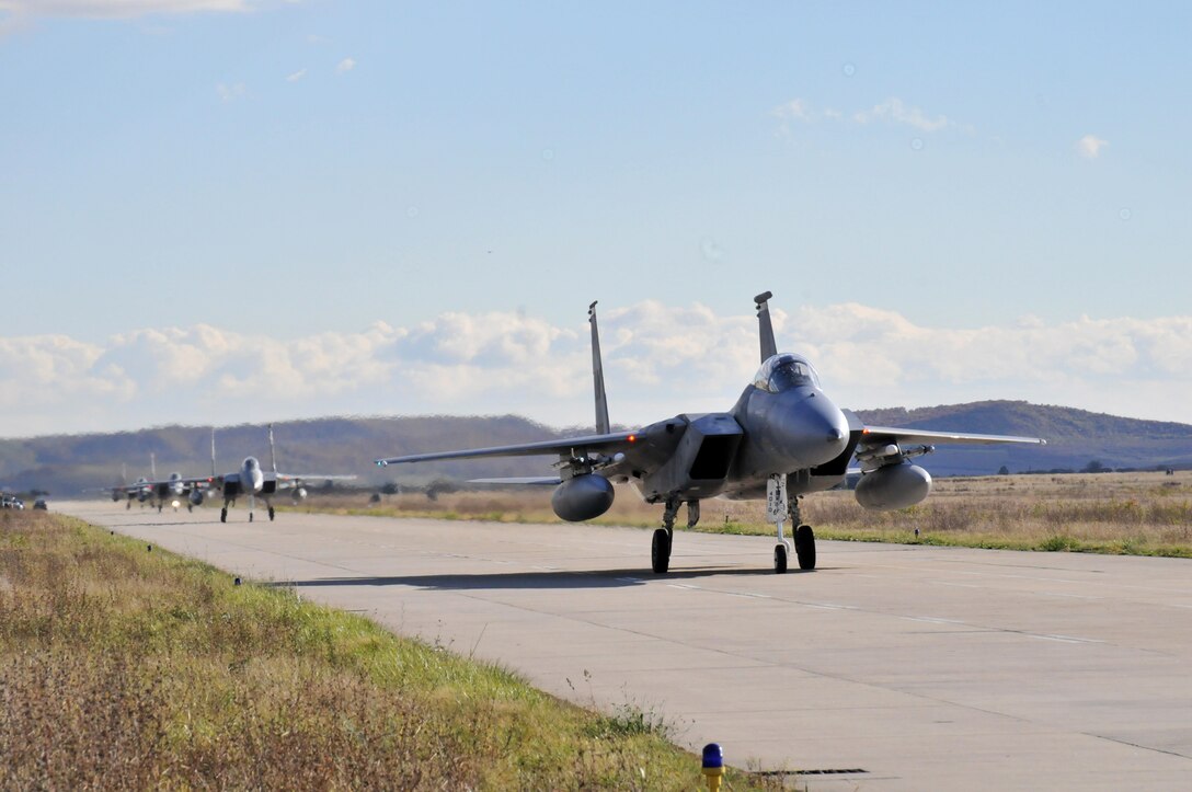 F-15 Eagle fighter aircraft taxi at Campia Turzii Air Base, Romania, Oct. 21. The aircraft, from the 493rd Fighter Squadron at Royal Air Force Lakenheath, England, came to Romania to participate in Operation Golden Lance, an exercise designed to build partnerships and increase interoperability between NATO allies. (U.S. Air Force photo/Senior Airman David Dobrydney)