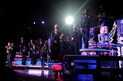 The entertainment cast from Tops In Blue line the stage for the grand finale and sing "I'm proud to be an American" at the North Charleston Performing Arts Center Oct. 21, 2010. Each year thousands audition and compete in base talent contests in hopes of becoming a part of Tops In Blue. The result is an elite group composed of 35 of the most talented vocalists, musicians and dancers that the Air Force has to offer. (U.S. Air Force Photo/Airman 1st Class Lauren Main)
