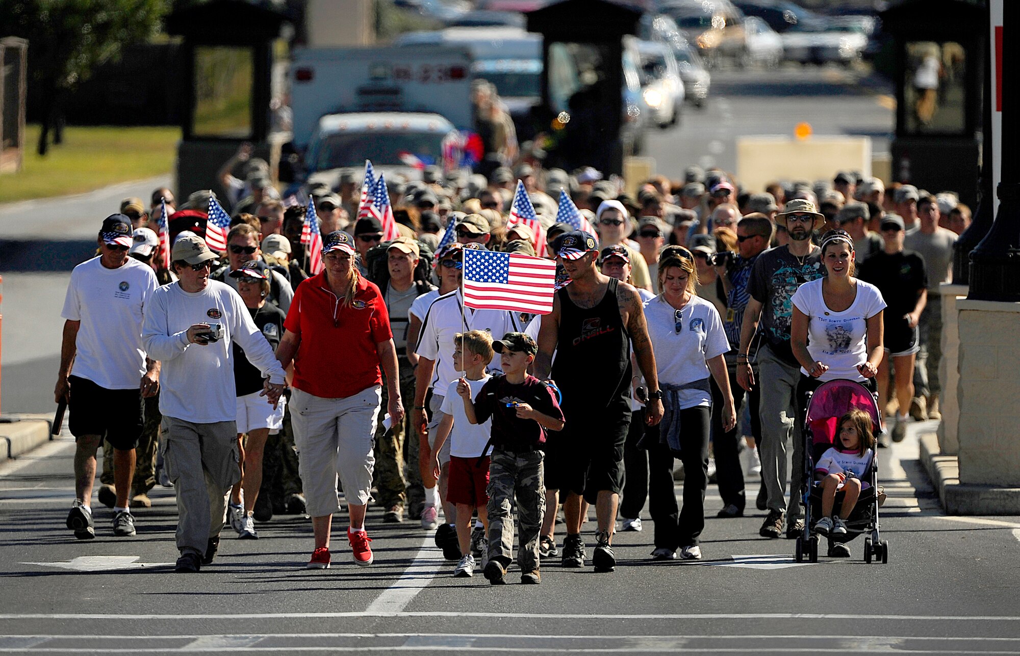 Surviving family members, a few wounded Airmen and members of the Air Force Special Operations Command, join fifteen Special Tactics Airmen Oct. 21, 2010, on the final stretch of an 860-mile memorial march from Lackland Air Force Base, Texas, to Hurlburt Field, Fla. (U.S. Air Force photo/Master Sgt. Russell E. Cooley IV)