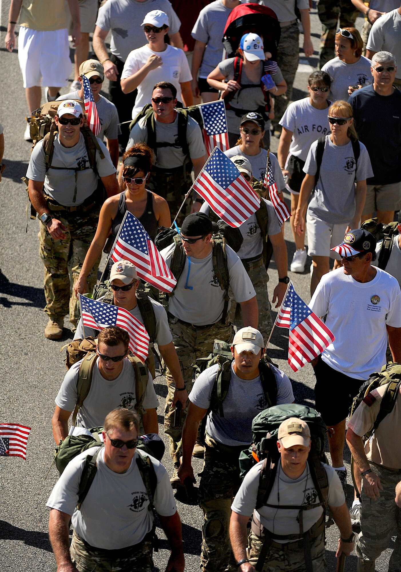 Surviving family members, a few wounded Airmen and members of the Air Force Special Operations Command, join fifteen Special Tactics Airmen Oct. 21, 2010, on the final stretch of an 860-mile memorial march from Lackland Air Force Base, Texas, to Hurlburt Field, Fla. (U.S. Air Force photo/Master Sgt. Russell E. Cooley IV)