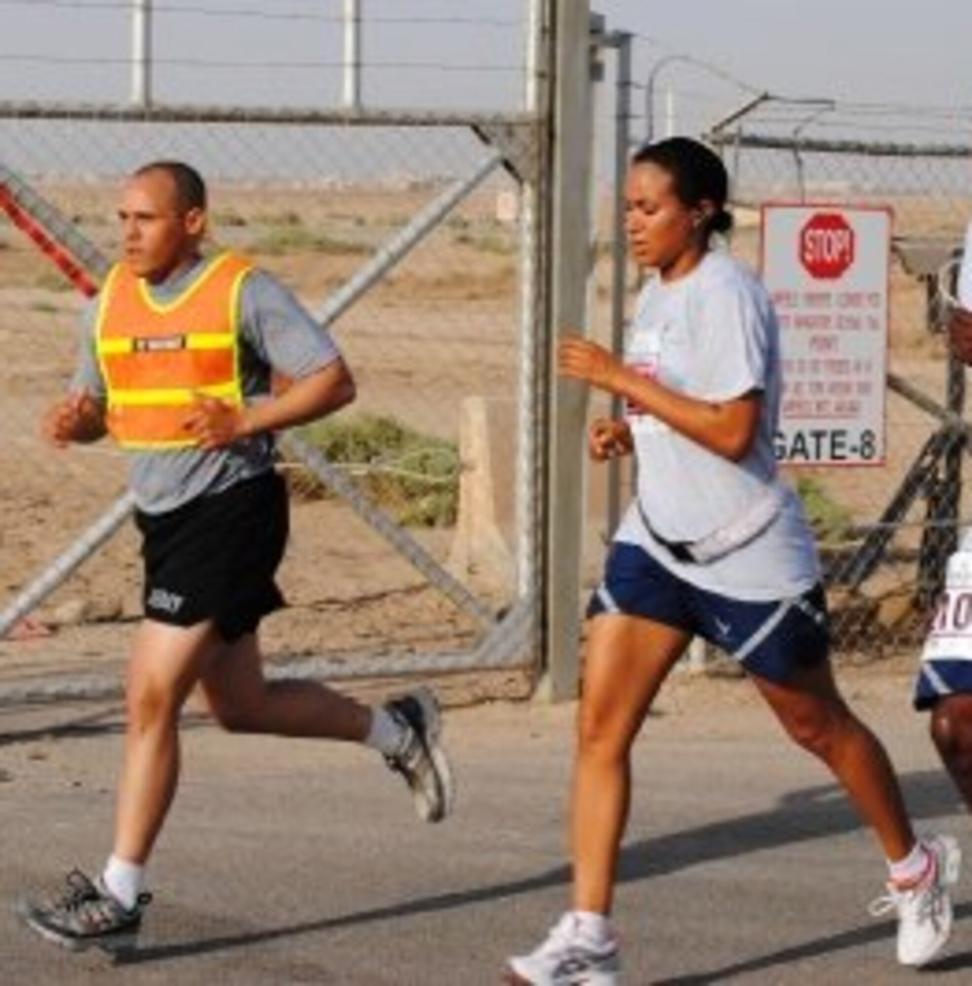 ALI BASE, Iraq - Tech. Sgt. Jennifer McKeithan (right), 509th Force Support Squadron, NCO in charge of readiness, participates in Air Force marathon while deployed. Sergeant McKeithan served as the recreation flight chief and spent 120-days deployed to the 407th Air Expeditionary Force Support Squadron, Ali Base, Iraq, and returned October 2009.  (Courtesy photo)
