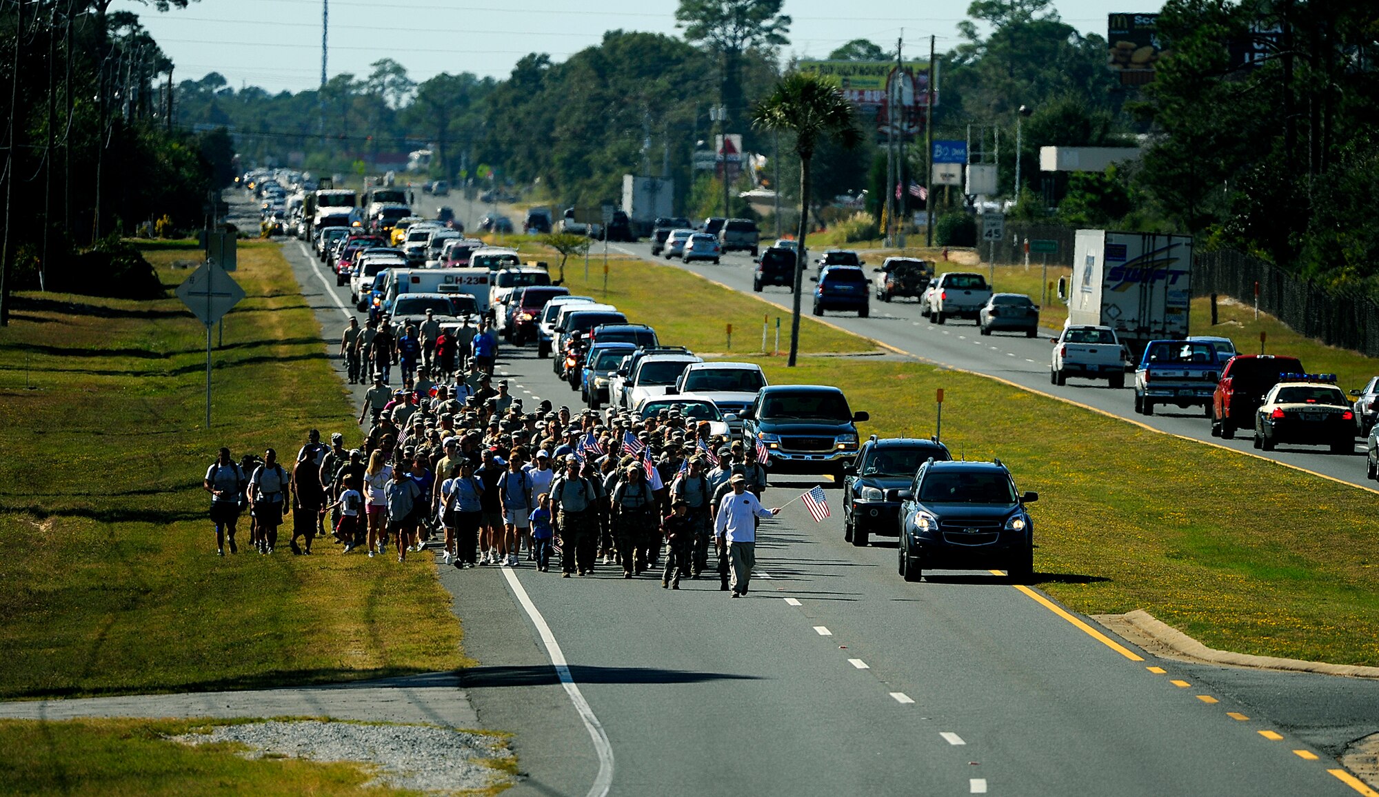 Surviving family members, a few wounded Airmen and members of the Air Force Special Operations Command, join fifteen Special Tactics Airmen Oct. 21, 2010, on the final stretch of an 860-mile memorial march from Lackland Air Force Base, Texas, to Hurlburt Field, Fla. (U.S. Air Force photo/Master Sgt. Russell E. Cooley IV)