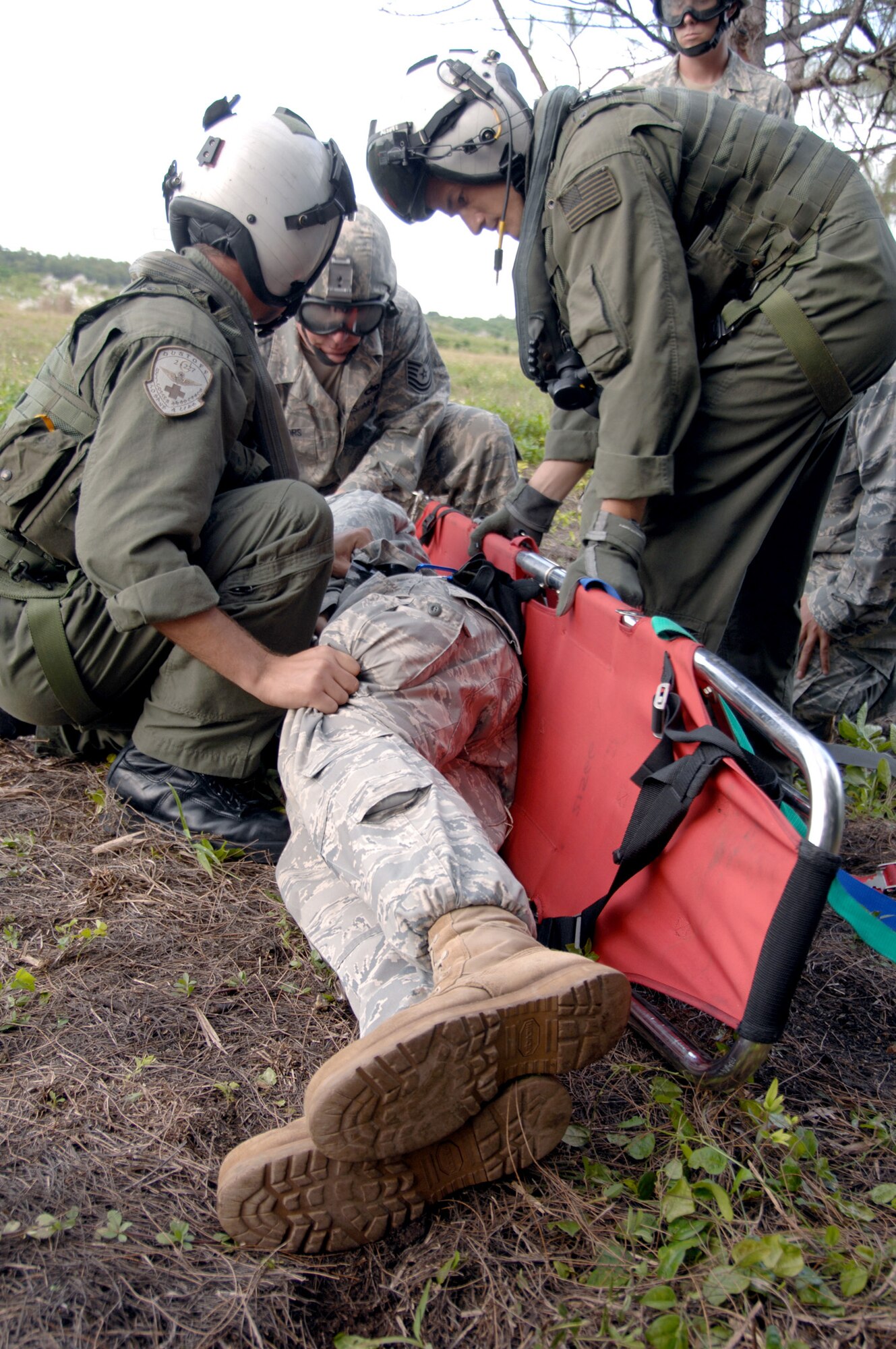 Servicemembers assigned to the 36th Mobility Response Squadron and HSC-25 conduct medical evacuation training Oct. 13, 2010, at Northwest Field, Guam. The joint field training exercise was performed in an effort to interchange and familiarize themselves with each other's tactics, techniques and procedures to be able to interoperate and conduct joint humanitarian assistance/disaster relief missions in the Pacific region. (U.S. Air Force photo/Airman 1st Class Anthony Jennings) 