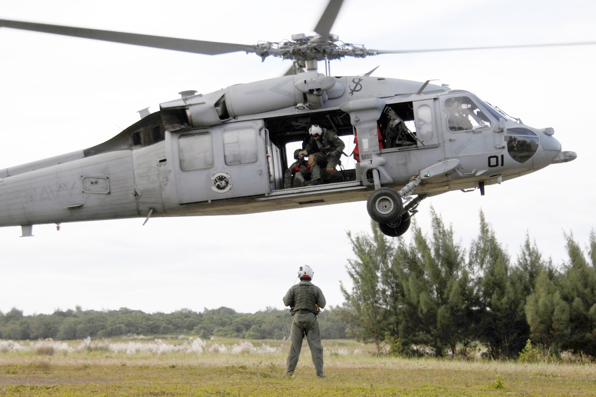 Servicemembers assigned to the 36th Mobility Response Squadron and HSC-25 conduct medical evacuation training Oct. 13, 2010, at Northwest Field, Guam. The joint field training exercise was performed in an effort to interchange and familiarize themselves with each other's tactics, techniques and procedures to be able to interoperate and conduct joint humanitarian assistance/disaster relief missions in the Pacific region. (U.S. Air Force photo/Airman 1st Class Anthony Jennings) 